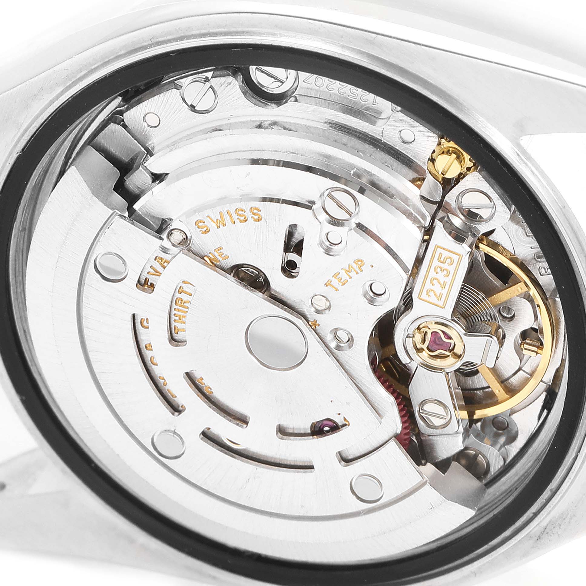 The image shows a close-up view of the movement mechanism of a Rolex Datejust 79163 Women
s Steel and Gold (two tone) Mother of Pearl Dial 79163 Women
s Steel and Gold (two tone) Mother of Pearl Dial watch.