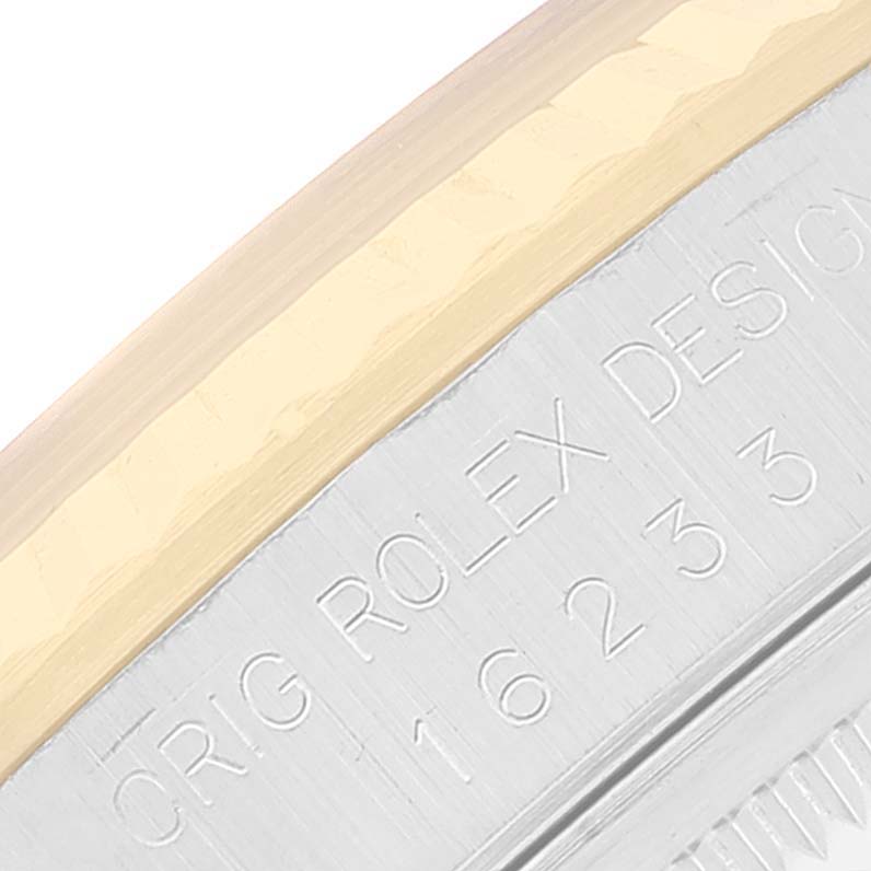 This close-up angle shows the engraved model number and part of the bezel on the Rolex Datejust 16233 Men's Steel and Gold (two tone) Champagne Dial 16233 Men's Steel and Gold (two tone) Champagne Dial watch.