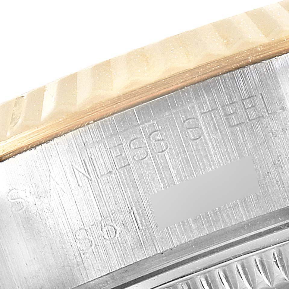The image shows a close-up of the bezel and part of the case back of a Rolex Datejust 69173 Women
s Steel and Gold (two tone) White Dial 69173 Women
s Steel and Gold (two tone) White Dial watch, highlighting the text "STAINLESS STEEL."
