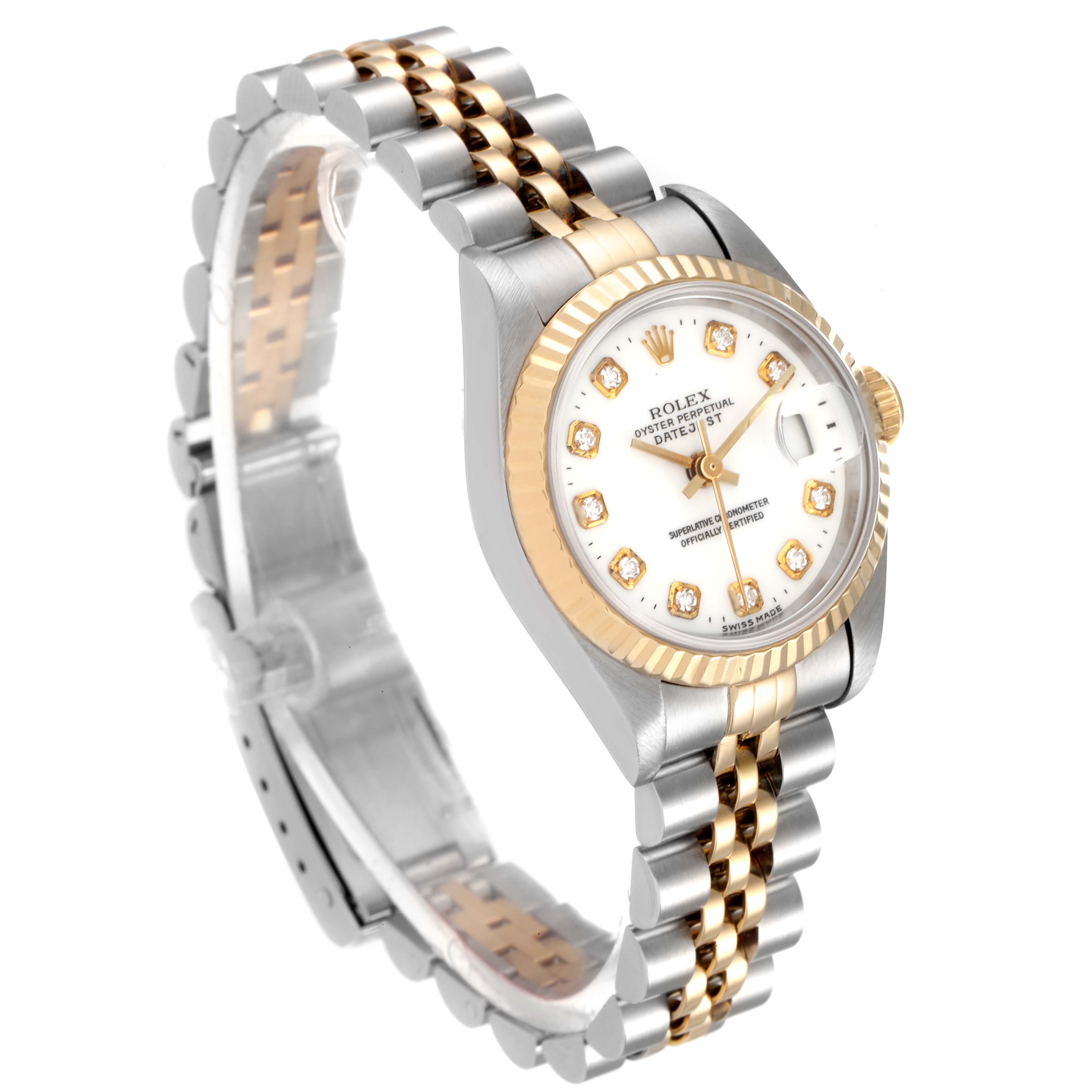 The image shows a Rolex Datejust 69173 Women
s Steel and Gold (two tone) White Dial 69173 Women
s Steel and Gold (two tone) White Dial watch at a three-quarter angle, highlighting its two-tone bracelet, white dial, and fluted bezel.