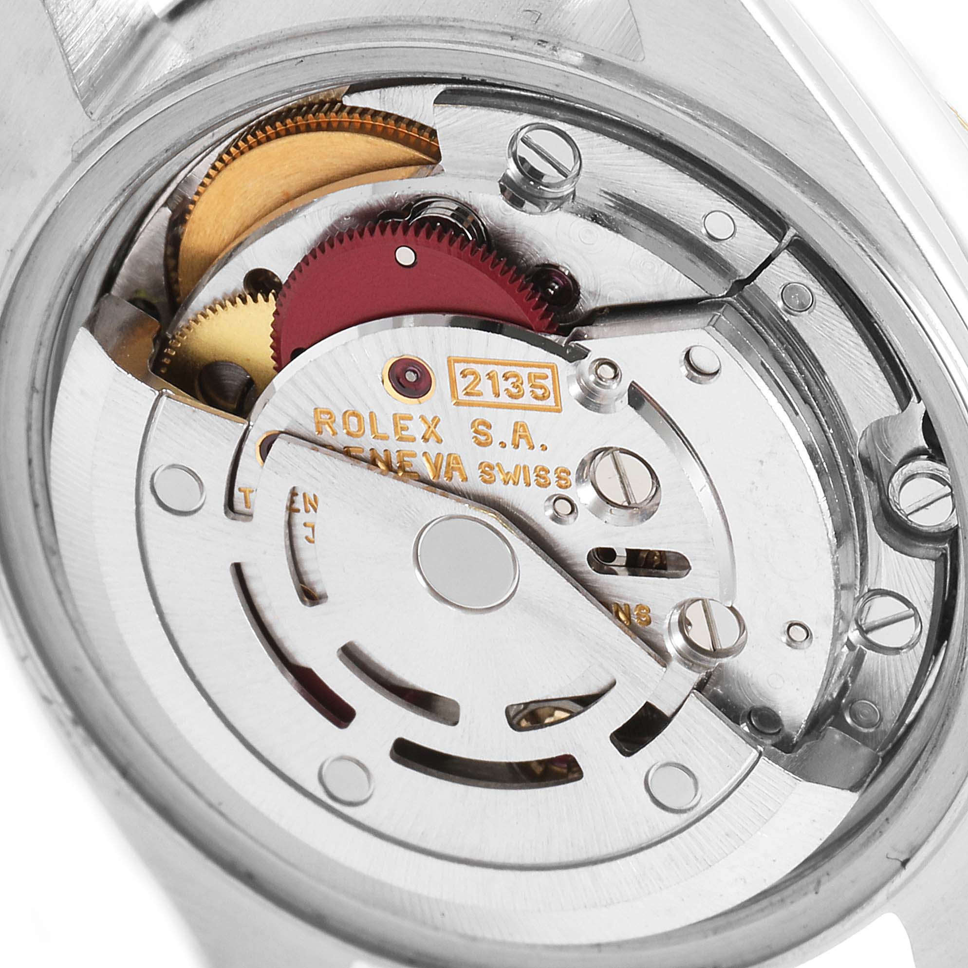 The image shows the inner mechanical movement of a Rolex Datejust 69173 Women
s Steel and Gold (two tone) White Dial 69173 Women
s Steel and Gold (two tone) White Dial watch, focusing on the gears and rotor.