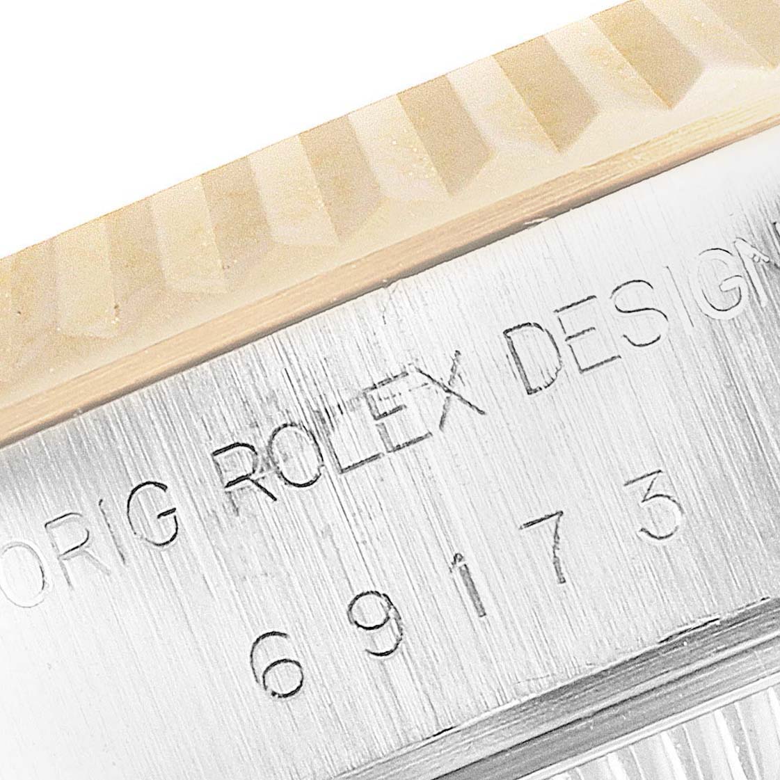 This image shows a close-up of the engraved bezel and casing of a Rolex Datejust 69173 Women
s Steel and Gold (two tone) White Dial 69173 Women
s Steel and Gold (two tone) White Dial watch.