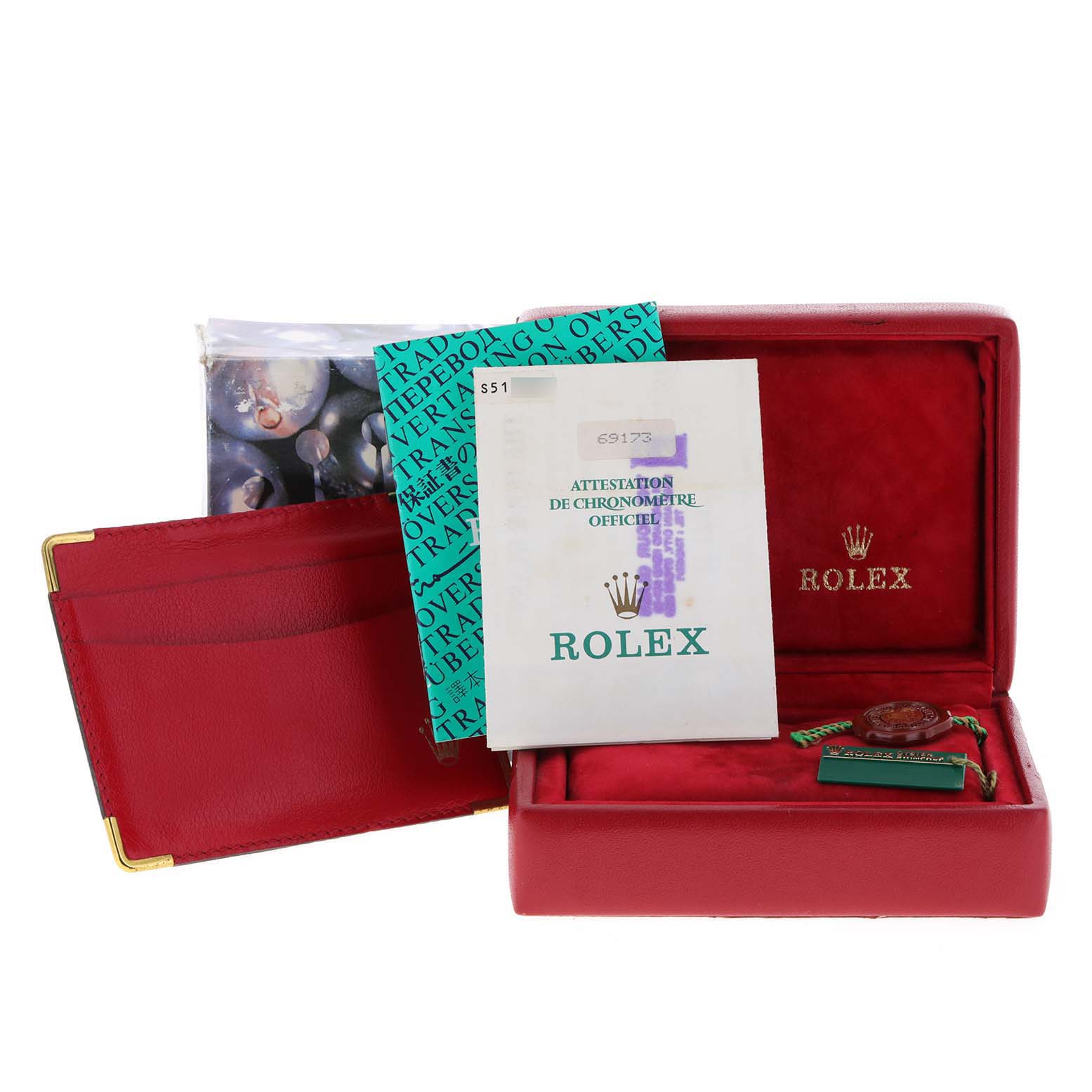 The image shows the packaging and paperwork, including booklets and tags, of a Rolex Datejust 69173 Women
s Steel and Gold (two tone) White Dial 69173 Women
s Steel and Gold (two tone) White Dial.