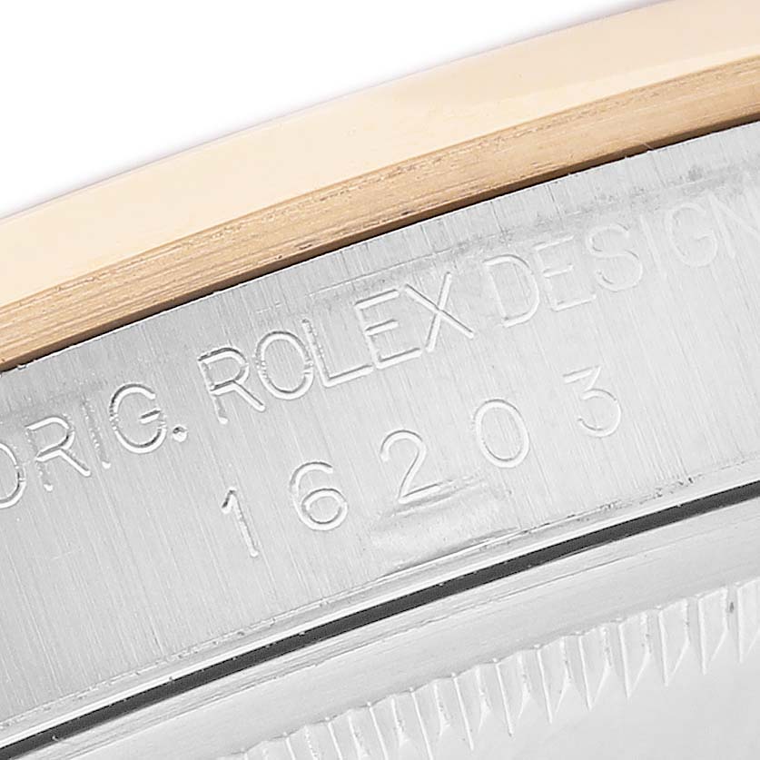 The image shows a close-up of the case side of a Rolex Datejust 16203 Men's Stainless Steel White Dial, highlighting engraved serial numbers.