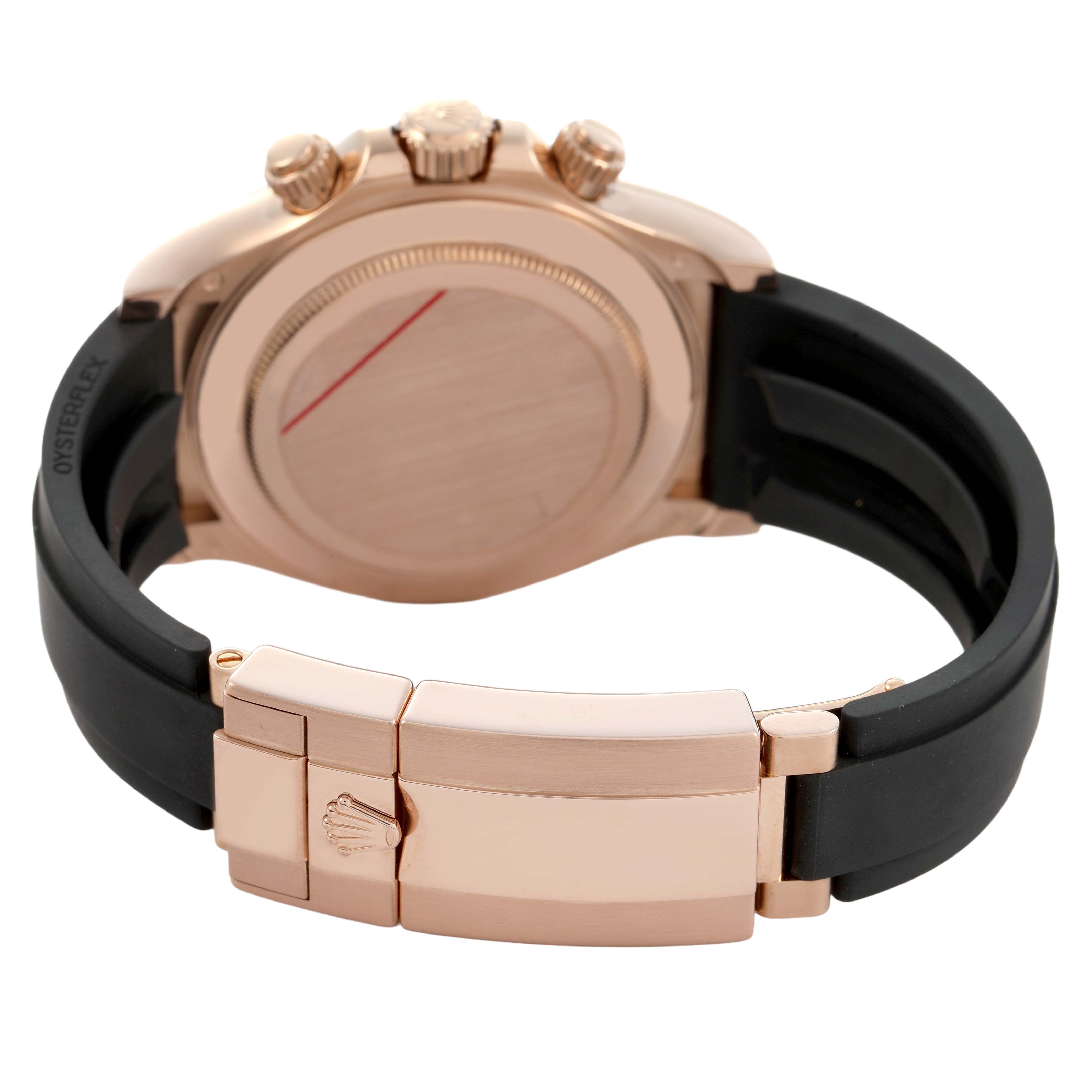The image shows the back and clasp of a Rolex Daytona 116515LN Men's Rose Gold Brown Dial, highlighting the rose gold case, crown, and black Oysterflex strap.