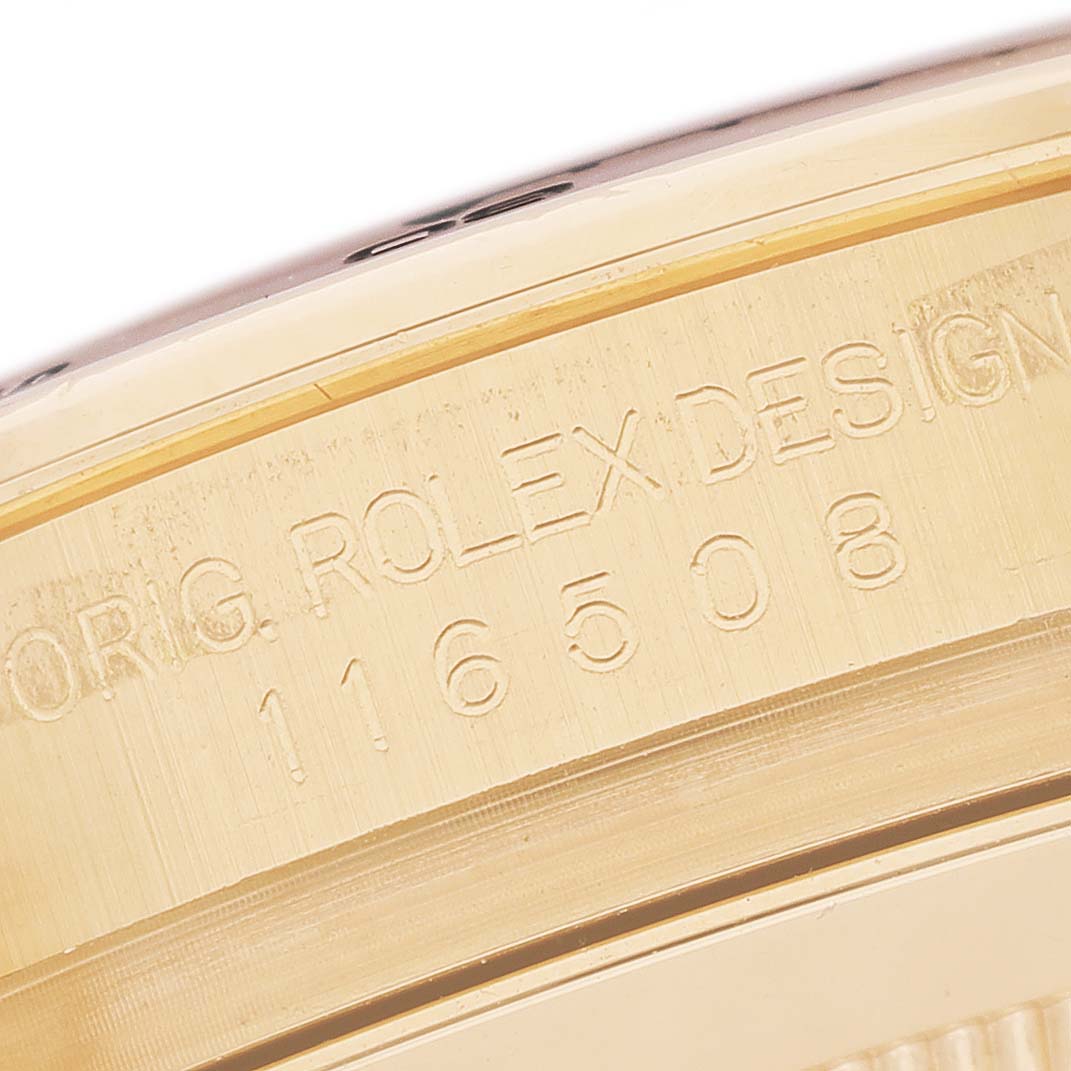 The image shows a close-up of the case edge of a Rolex Daytona 116508 Men's Yellow Gold Black Dial, highlighting the engraved design and model number.