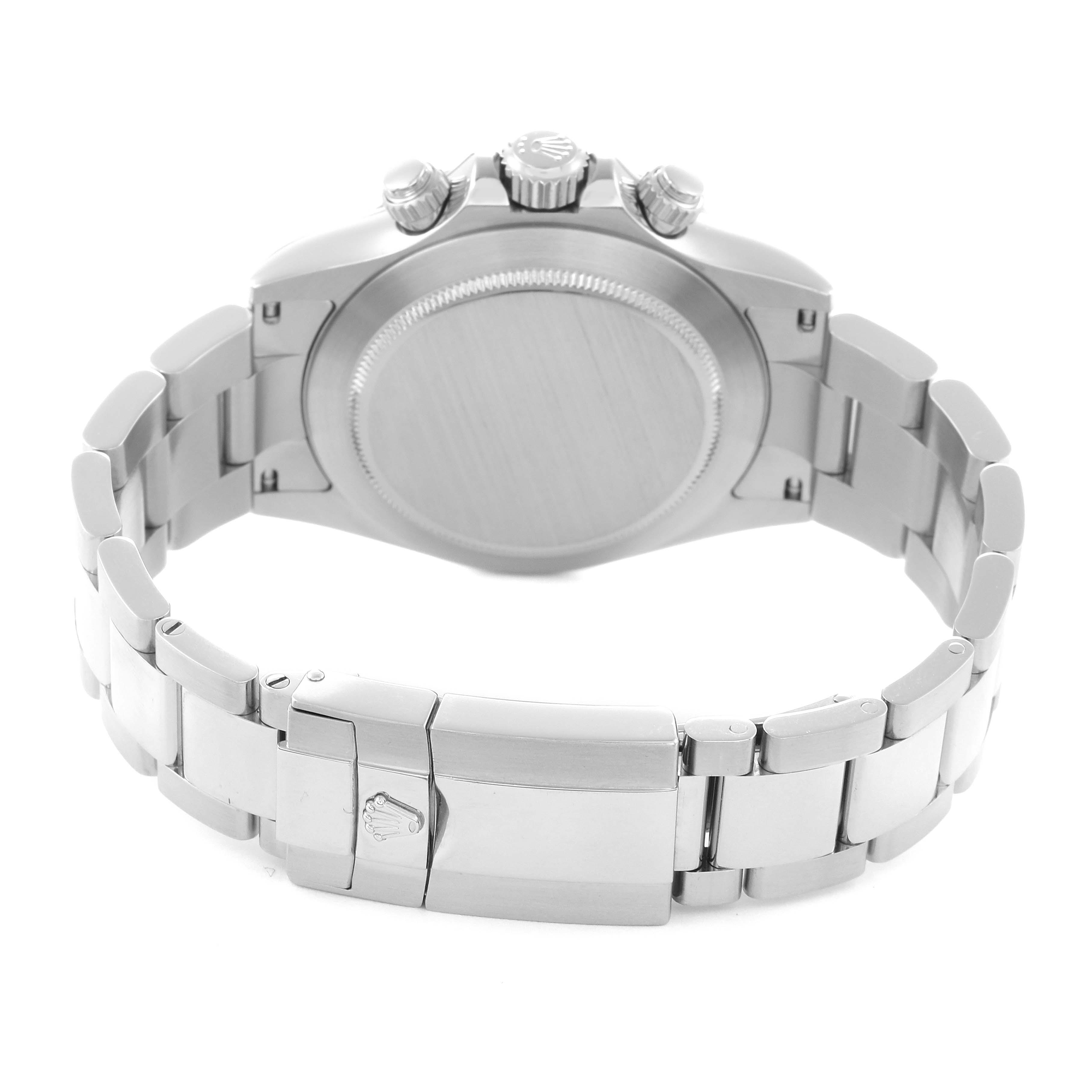 The image shows the back view of a Rolex Daytona model 116520 men's watch, highlighting the case back, bracelet, and clasp.