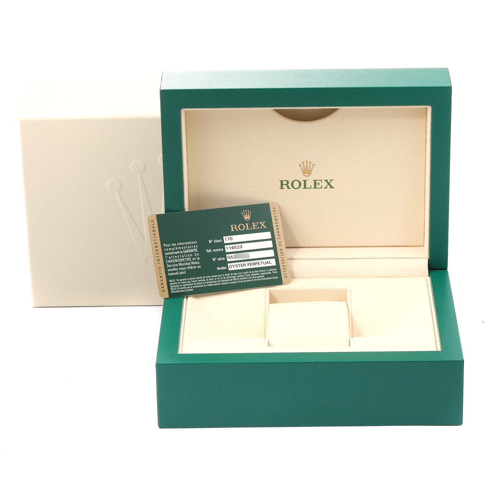 This image shows a green and beige Rolex Daytona 116523 Men's Steel and Gold (two tone) Black Dial 116523 Men's Steel and Gold (two tone) Black Dial watch box, open, with an authenticity card displayed inside.