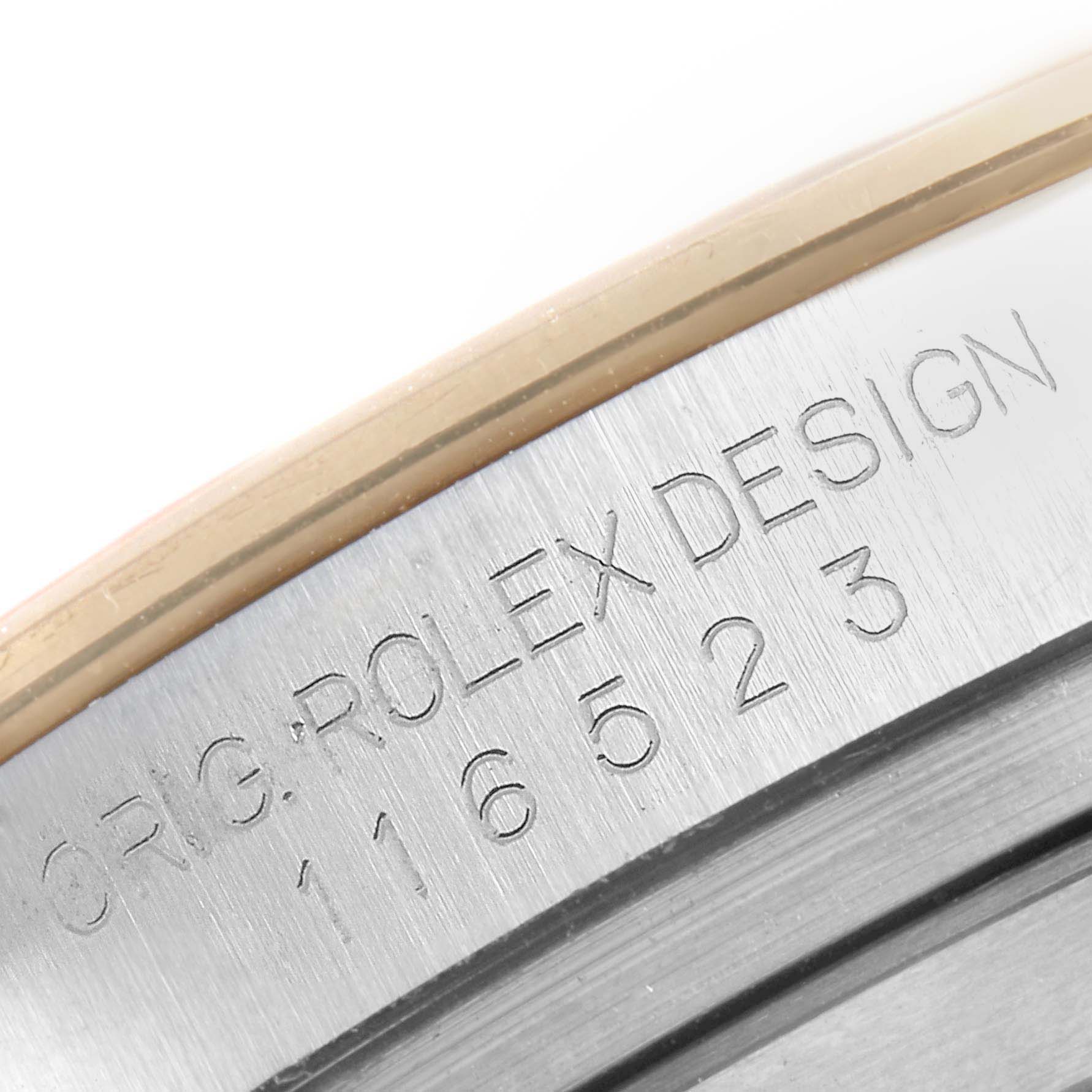 The image shows a close-up of the serial number engraving on the side of the Rolex Daytona 116523 Men's Steel and Gold (two tone) Black Dial 116523 Men's Steel and Gold (two tone) Black Dial watch case.