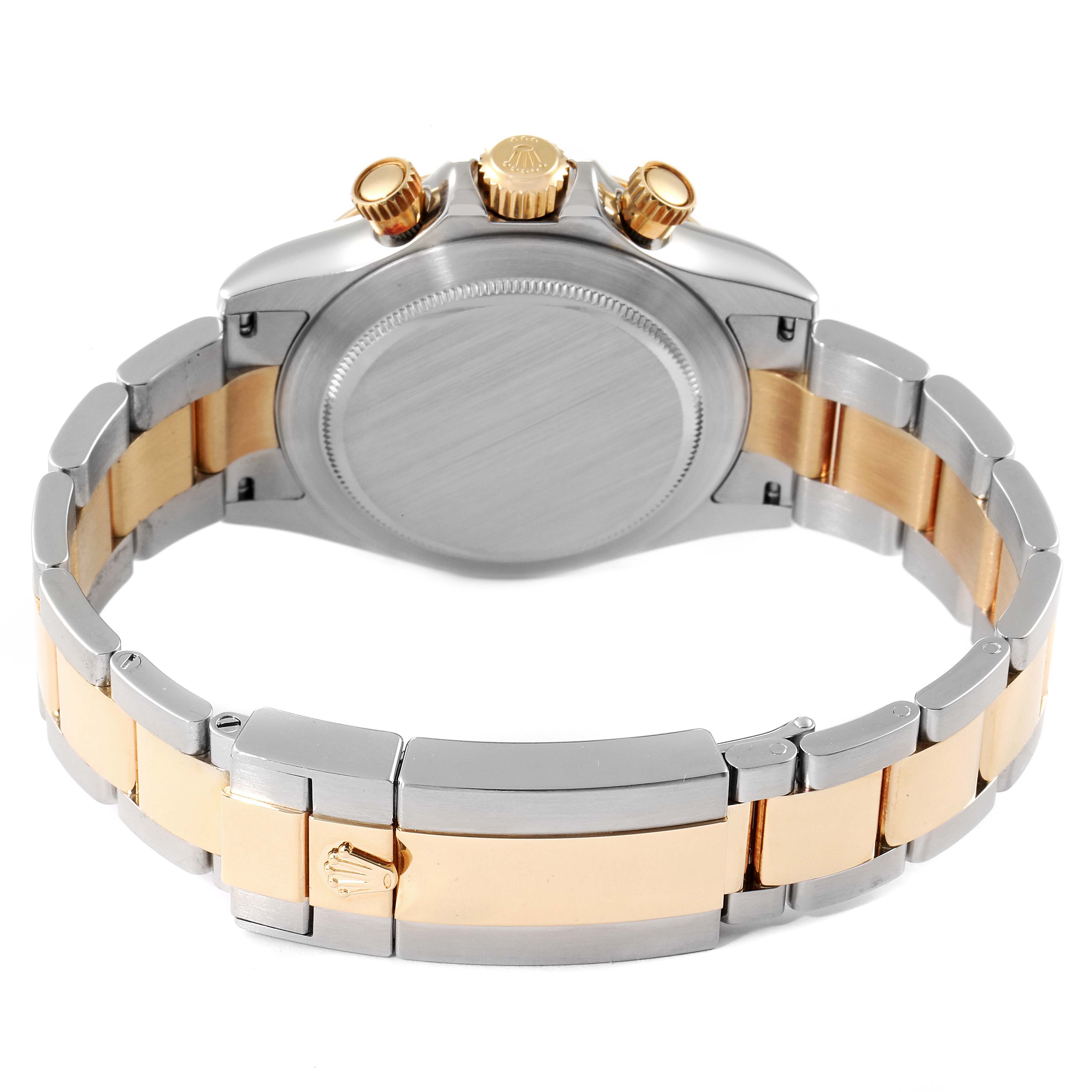 This image shows the back case and bracelet of a Rolex Daytona 116523 Men's Steel and Gold (two tone) Black Dial 116523 Men's Steel and Gold (two tone) Black Dial watch at a rear angle.