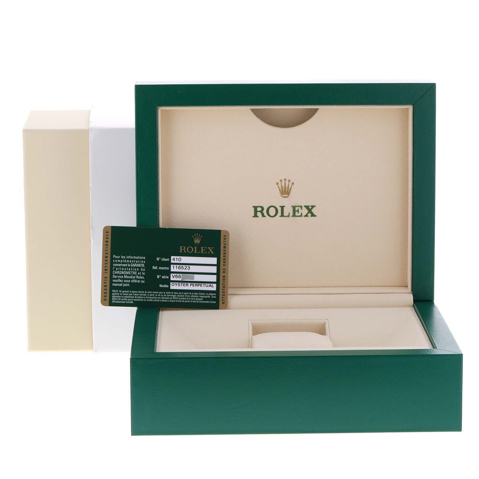 The image shows a Rolex Daytona 116523 Men's Steel and Gold (two tone) Black Dial 116523 Men's Steel and Gold (two tone) Black Dial watch box, partially open, with an authenticity card visible.
