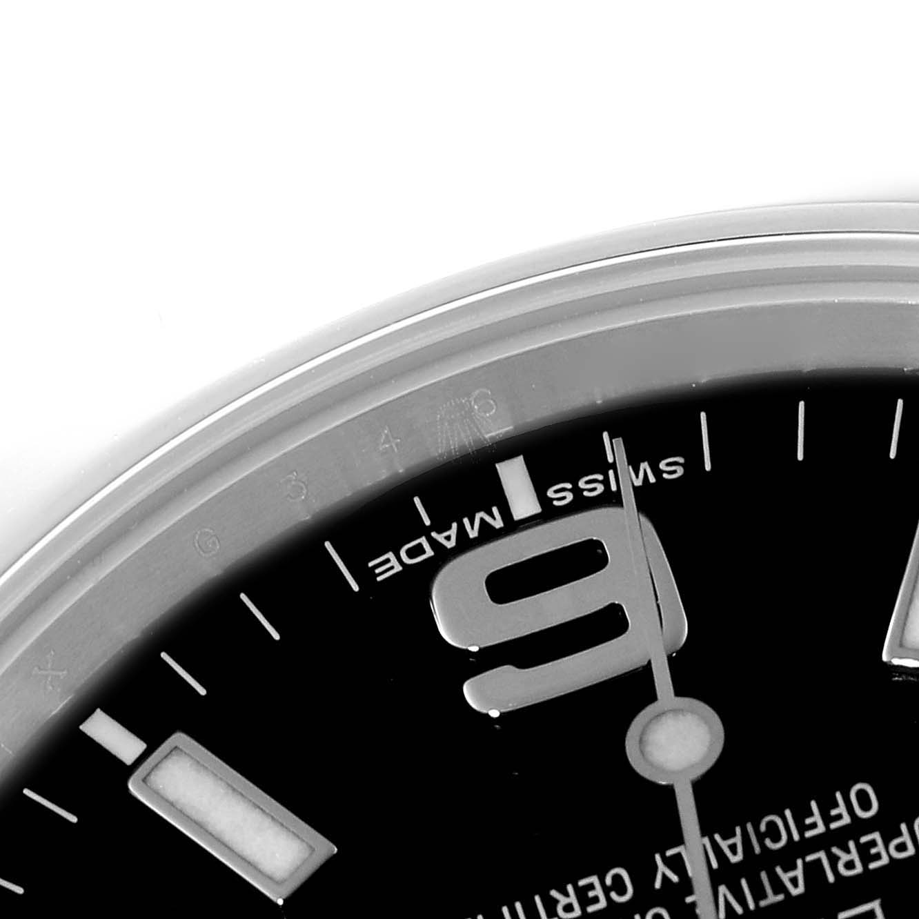 The image shows a close-up of the dial and part of the bezel of the Rolex Explorer 214270 Men's Stainless Steel Black Dial 214270 Men's Stainless Steel Black Dial watch, highlighting the 9 o'clock marker.