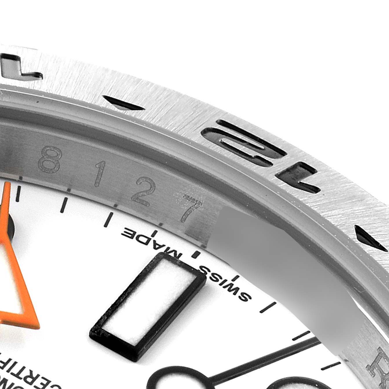 The image shows a close-up of the bezel, dial, and hands of a Rolex Explorer 216570 Men's Stainless Steel White Dial 216570 Men's Stainless Steel White Dial watch.