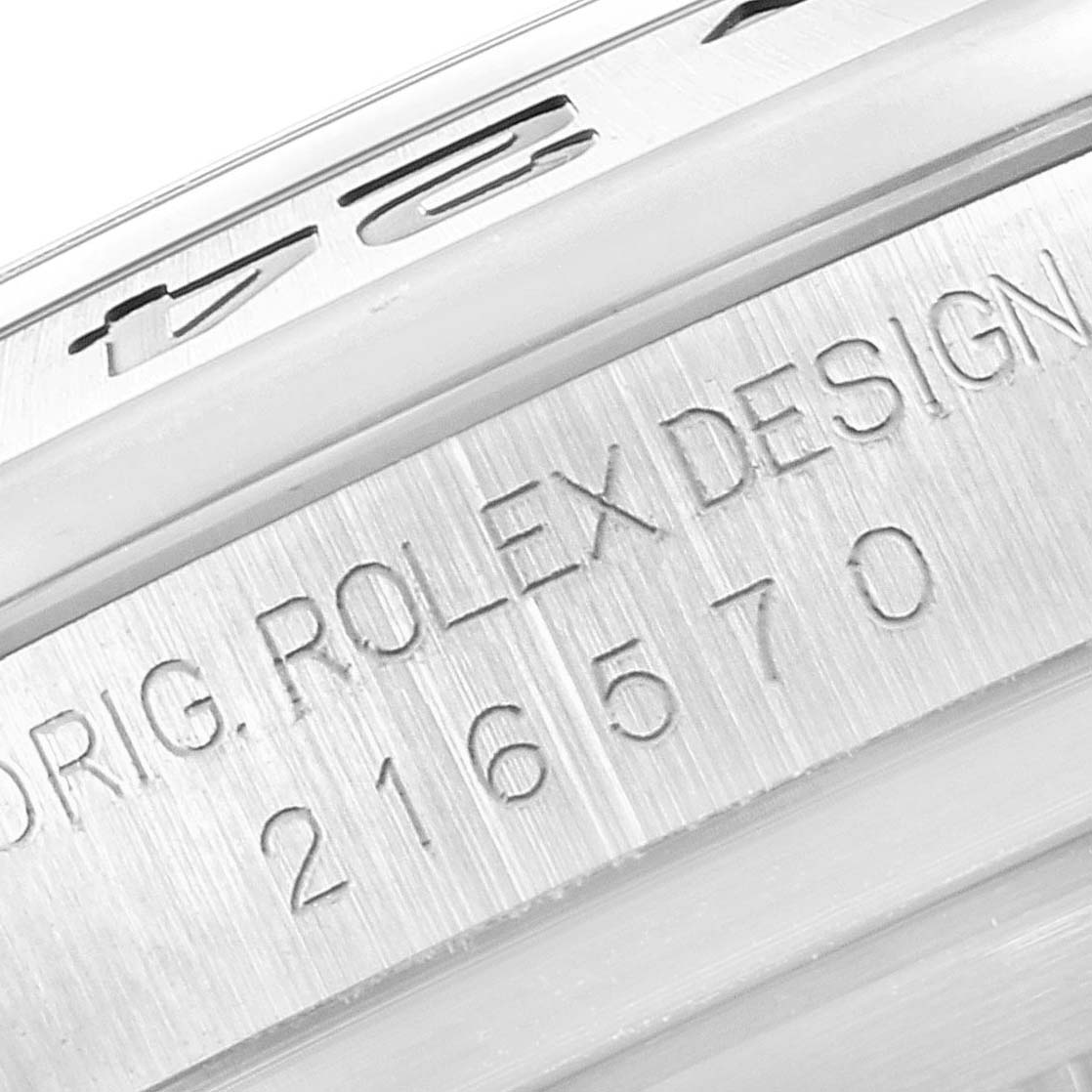 This image shows a close-up of the case and bezel engravings of a Rolex Explorer 216570 Men's Stainless Steel White Dial 216570 Men's Stainless Steel White Dial watch, revealing the model number and design details.
