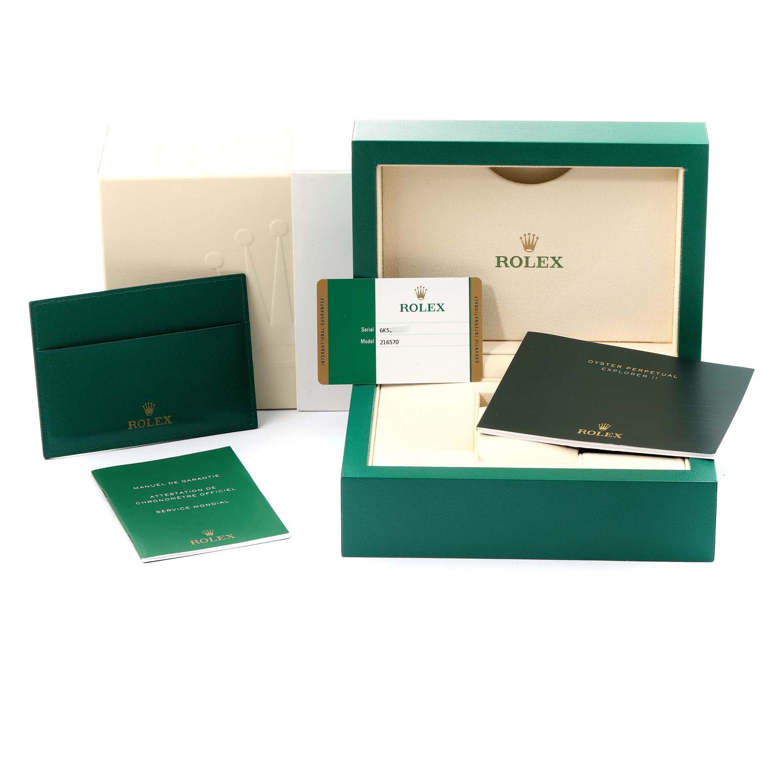 The image shows the packaging and accessories of a Rolex Explorer 216570 Men's Stainless Steel White Dial 216570 Men's Stainless Steel White Dial, including its box, warranty card, and manuals.