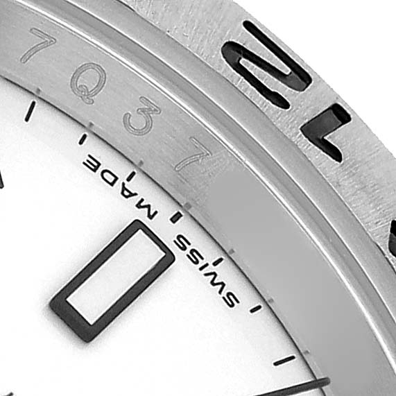 The image shows a close-up of the Rolex Explorer 16570 T Men's Stainless Steel White Dial watch's dial, bezel, and indices at an angled view.