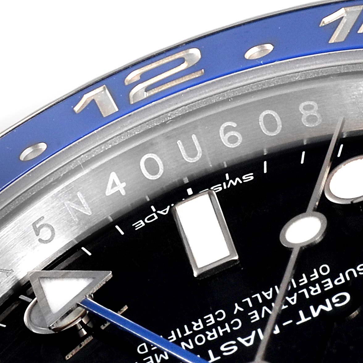 This image shows a close-up angle of the Rolex GMT-Master 116710 Men
s Stainless Steel Black Dial 116710 Men
s Stainless Steel Black Dial watch, focusing on the bezel, hour markers, and part of the dial.