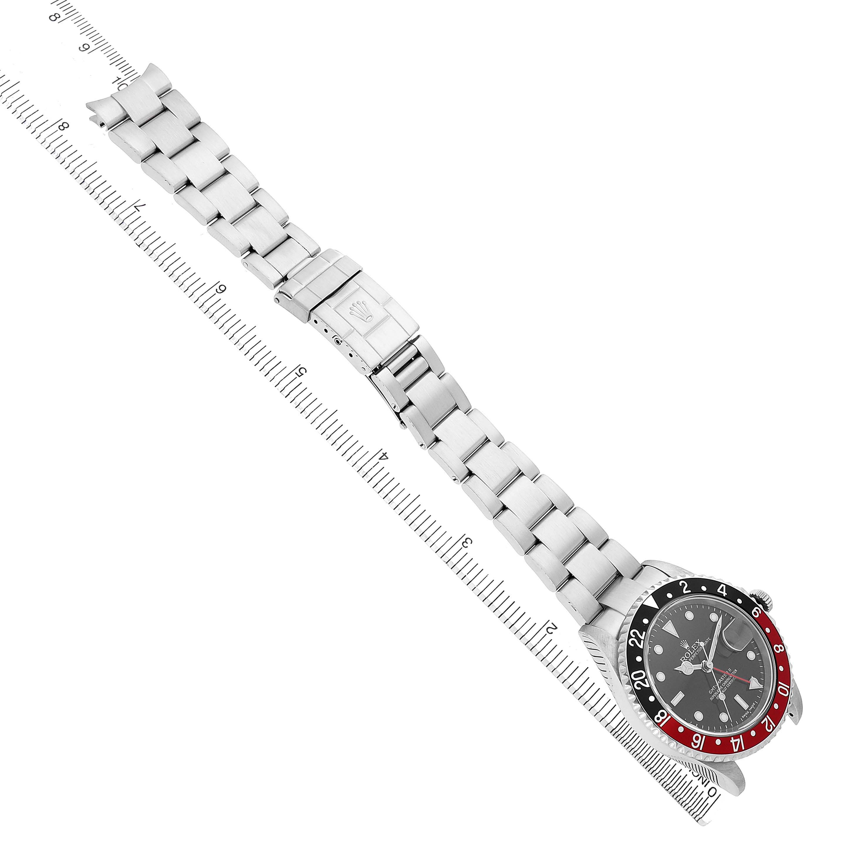 The Rolex GMT-Master 16710 Men's Stainless Steel Black Dial is shown from a top-down angle, displaying the dial, bezel, and metal bracelet with clasp.