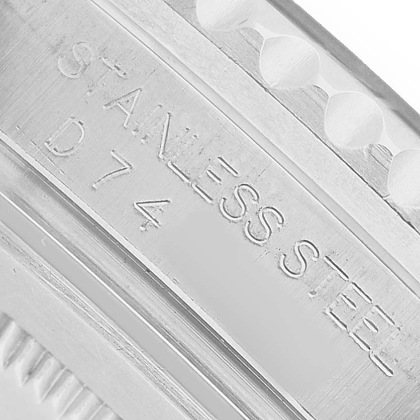 The image shows the engraved side of a Rolex GMT-Master 16710 Men's Stainless Steel Black Dial watch case in stainless steel.