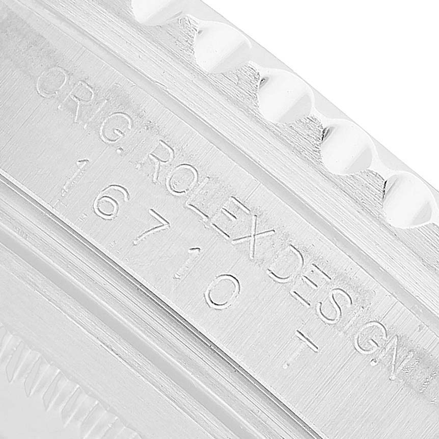 The image shows an angled view of the case edge and engraved model number "16710" on the Rolex GMT-Master 16710 Men's Stainless Steel Black Dial.