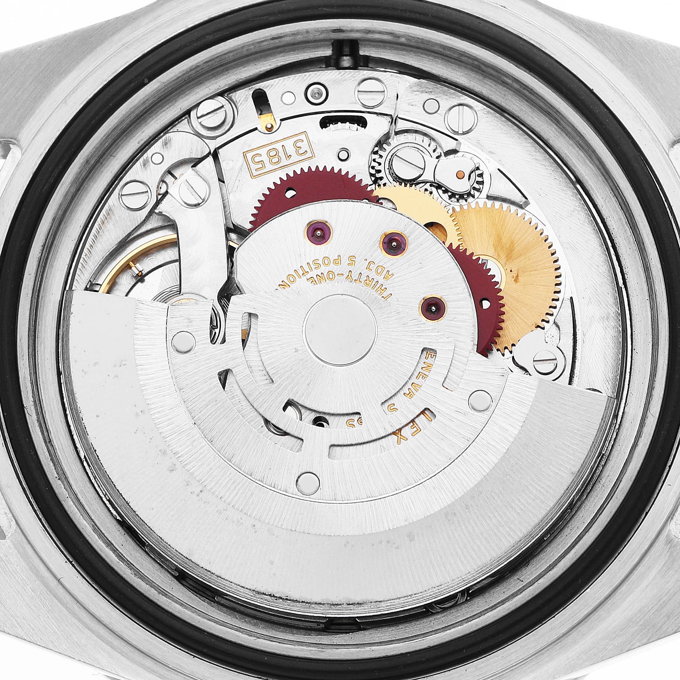 The image shows the movement mechanism of a Rolex GMT-Master 16710 Men's Stainless Steel Black Dial watch from a rear angle, highlighting gears and internal components.