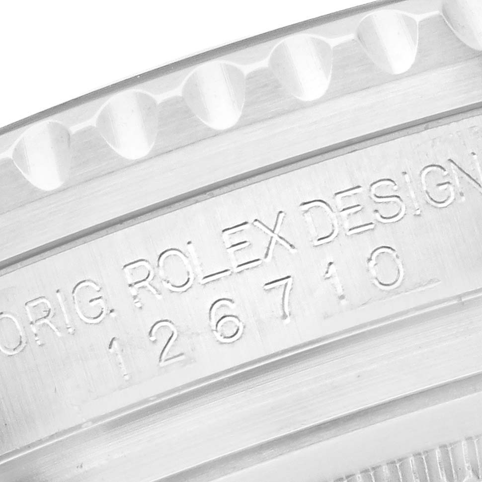 The image shows a close-up of the side casing of the Rolex GMT-Master model 126710BLRO, highlighting the engraved model number.
