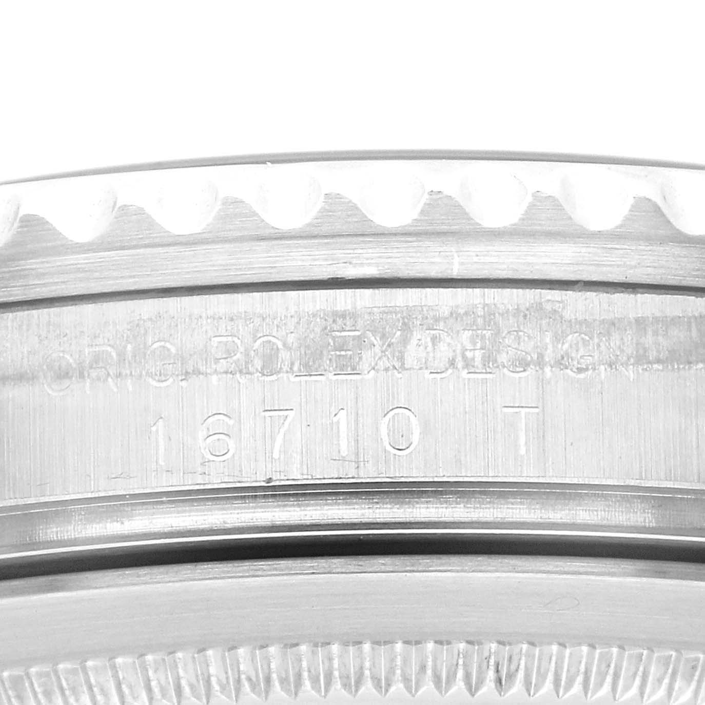 This image shows a close-up of the side of a Rolex GMT-Master 16710 Men's Stainless Steel Black Dial 16710 Men's Stainless Steel Black Dial watch case, revealing the model number 16710 and the "ORIG ROLEX DESIGN" engraving.