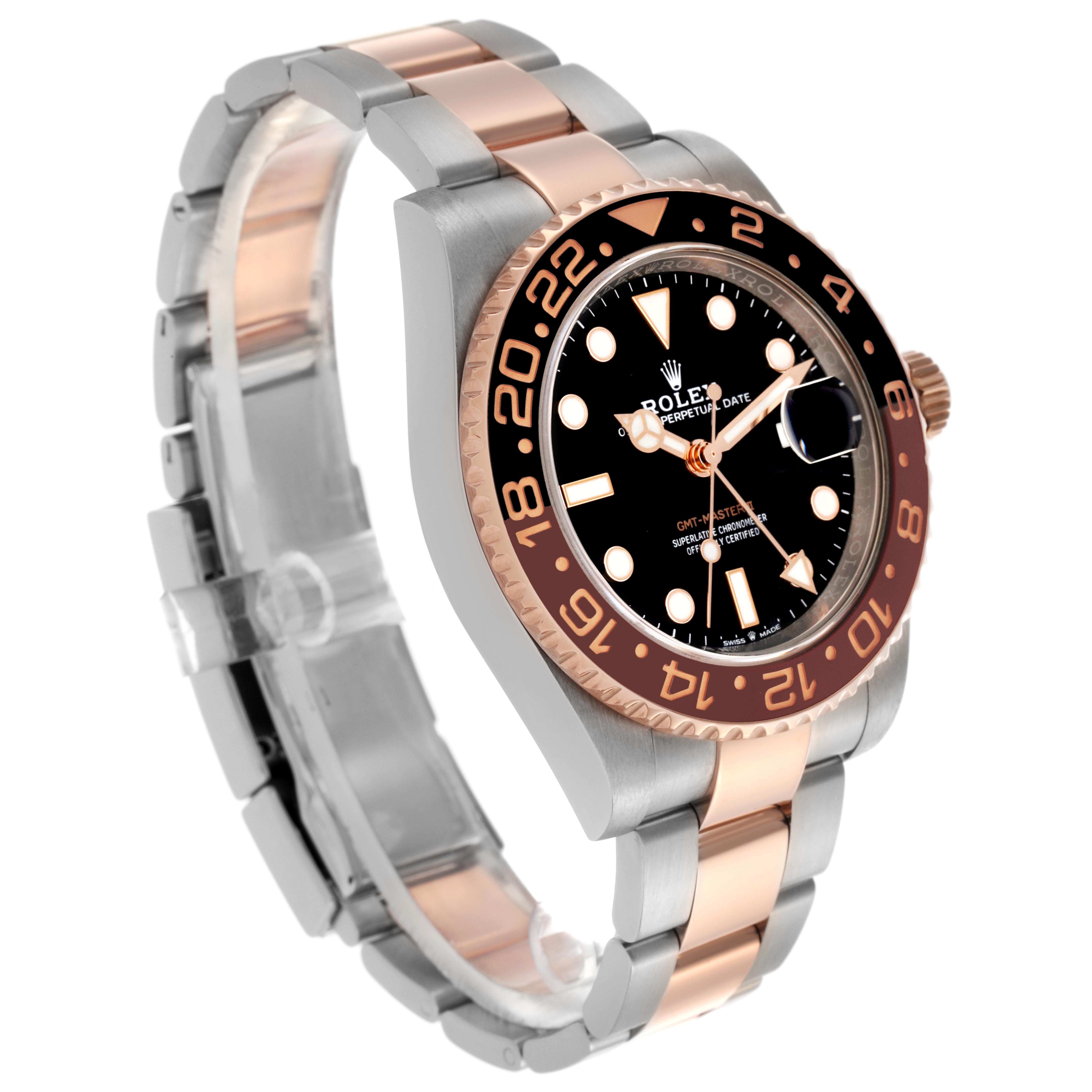 The Rolex GMT-Master model 126711 is shown at a slight angle, highlighting the two-tone bracelet, bezel, and face with its distinctive details.