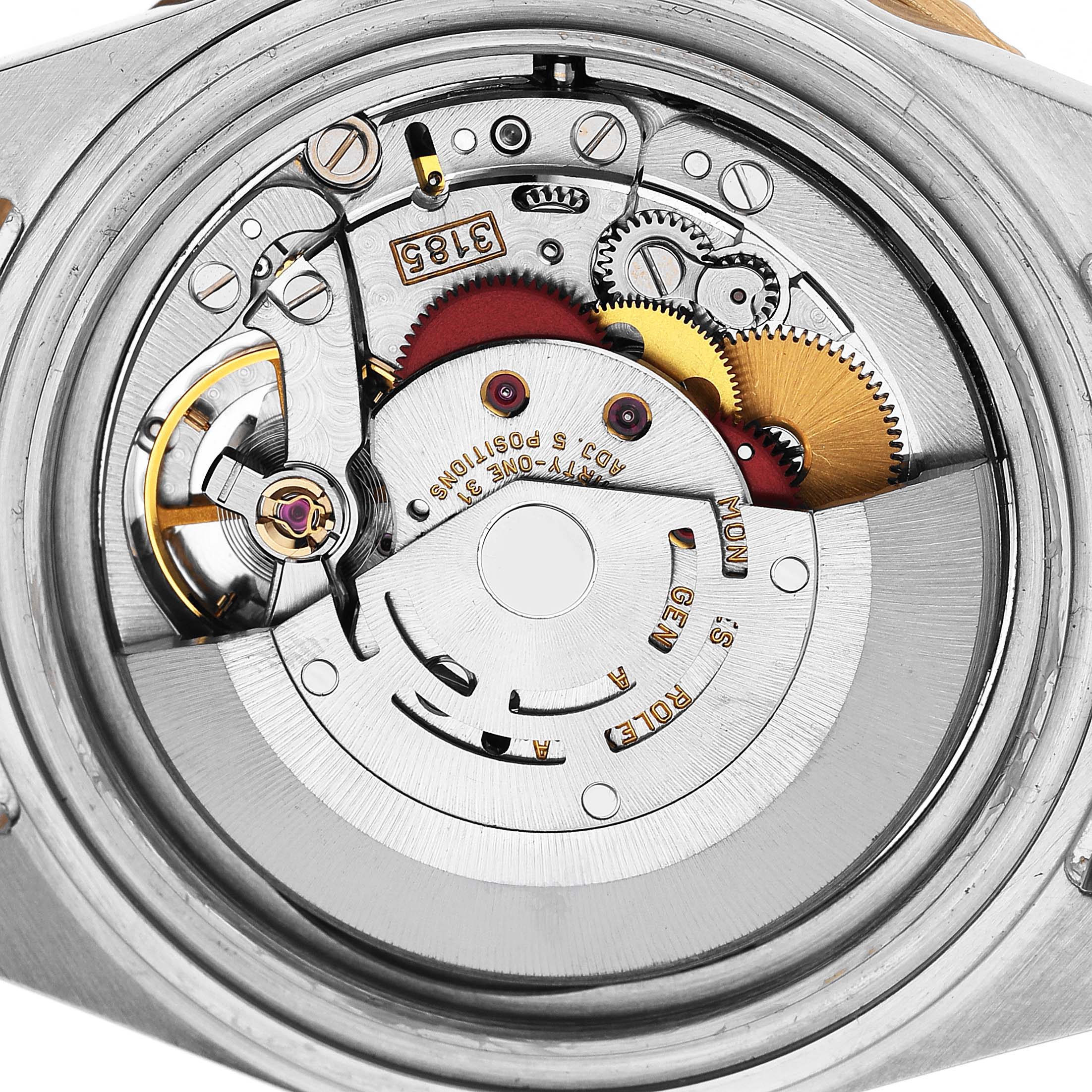 The image shows the internal movement mechanism of a Rolex GMT-Master 16713 Men's Steel and Gold (two tone) Black Dial watch from a top-down angle.