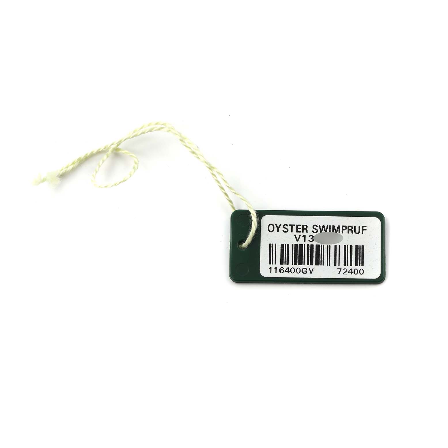 The image shows a tag for a Rolex Milgauss, model 116400GV, with "Oyster Swimpruf" and a barcode printed on it.