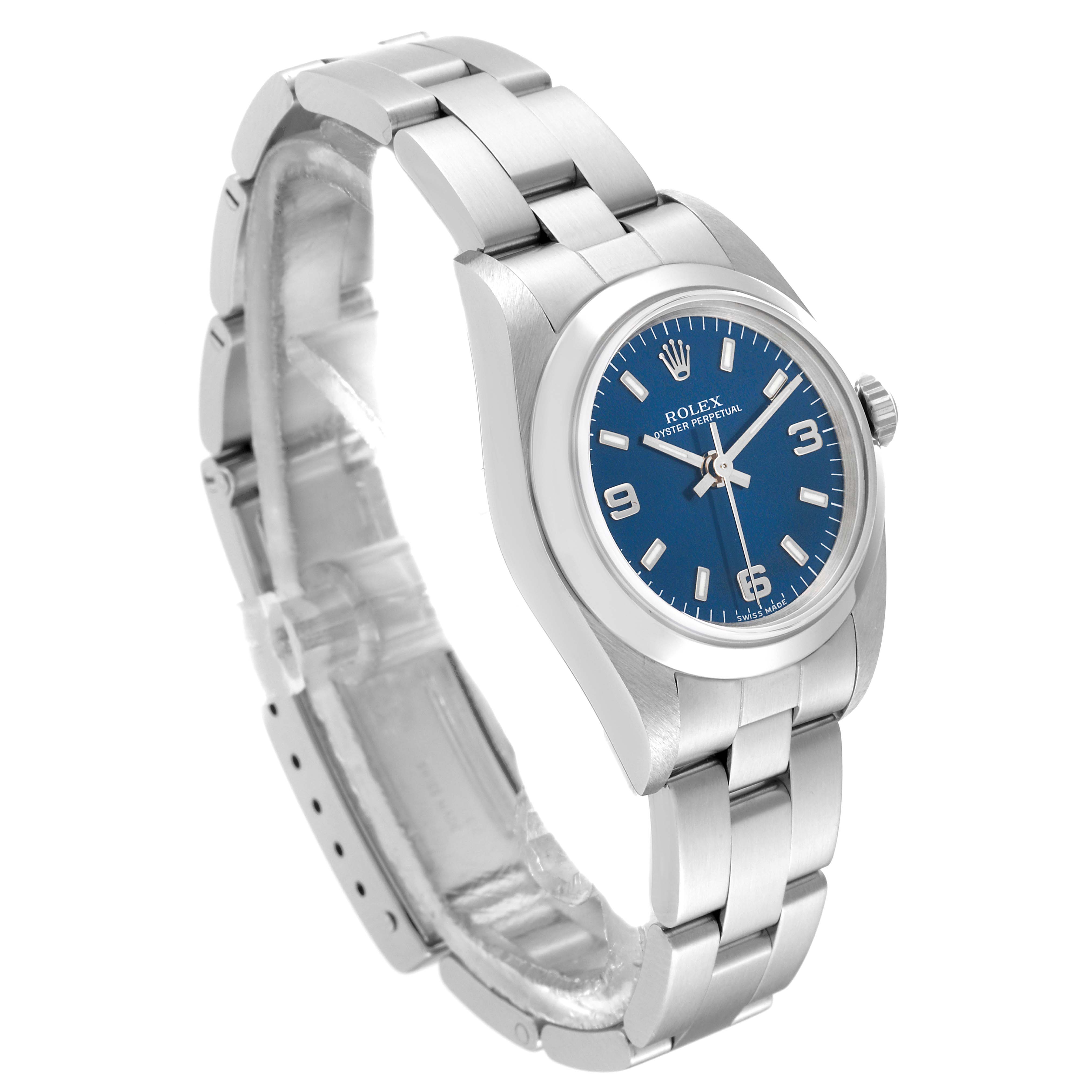 The Rolex Oyster Perpetual 76080 Women's Stainless Steel Blue Dial 76080 Women's Stainless Steel Blue Dial watch shown features a side angle view of the blue dial, stainless steel case, and bracelet.
