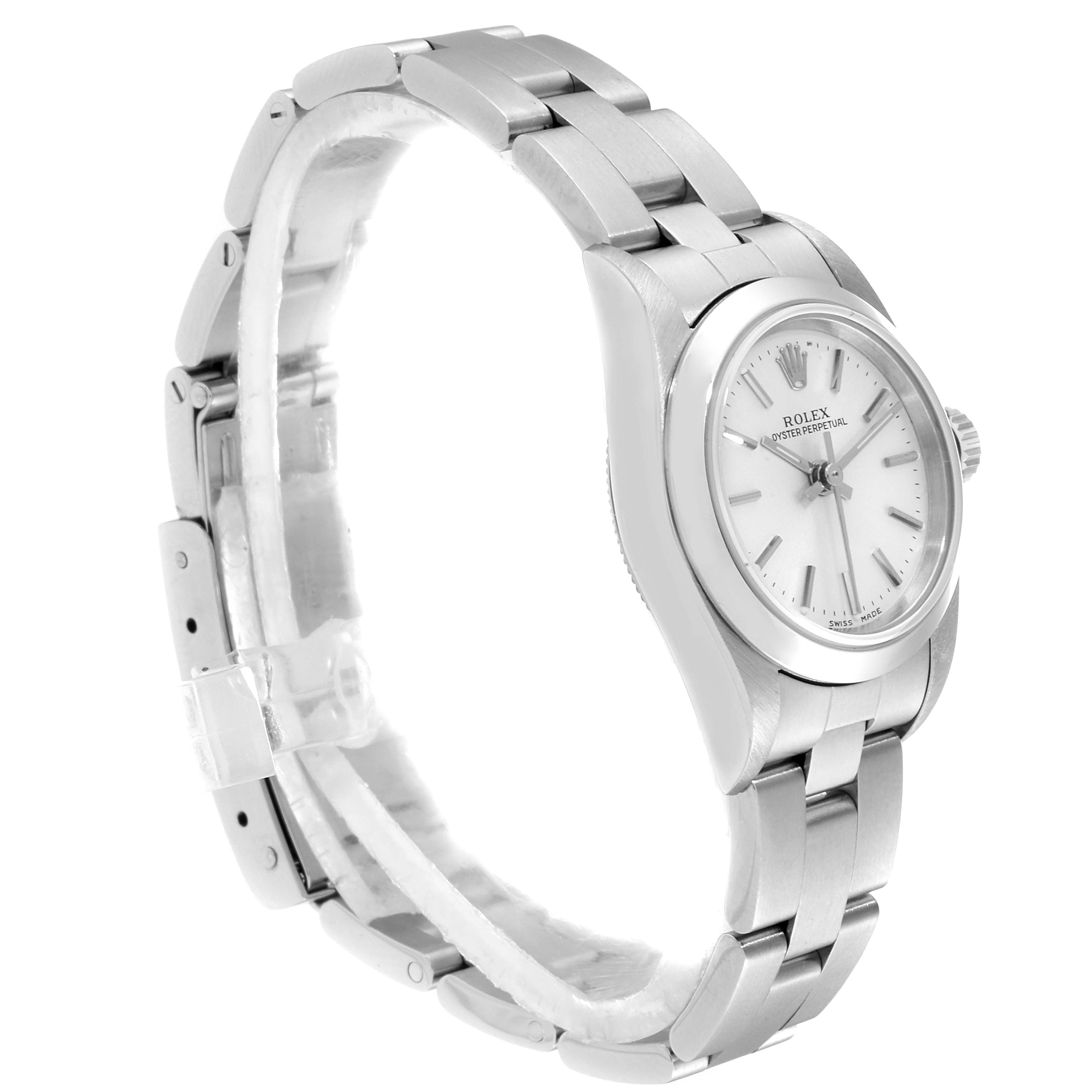 The Rolex Oyster Perpetual 76080 Women's Stainless Steel Silver Dial 76080 Women's Stainless Steel Silver Dial watch is shown at a side angle, highlighting its white dial, stainless steel bracelet, and clasp.