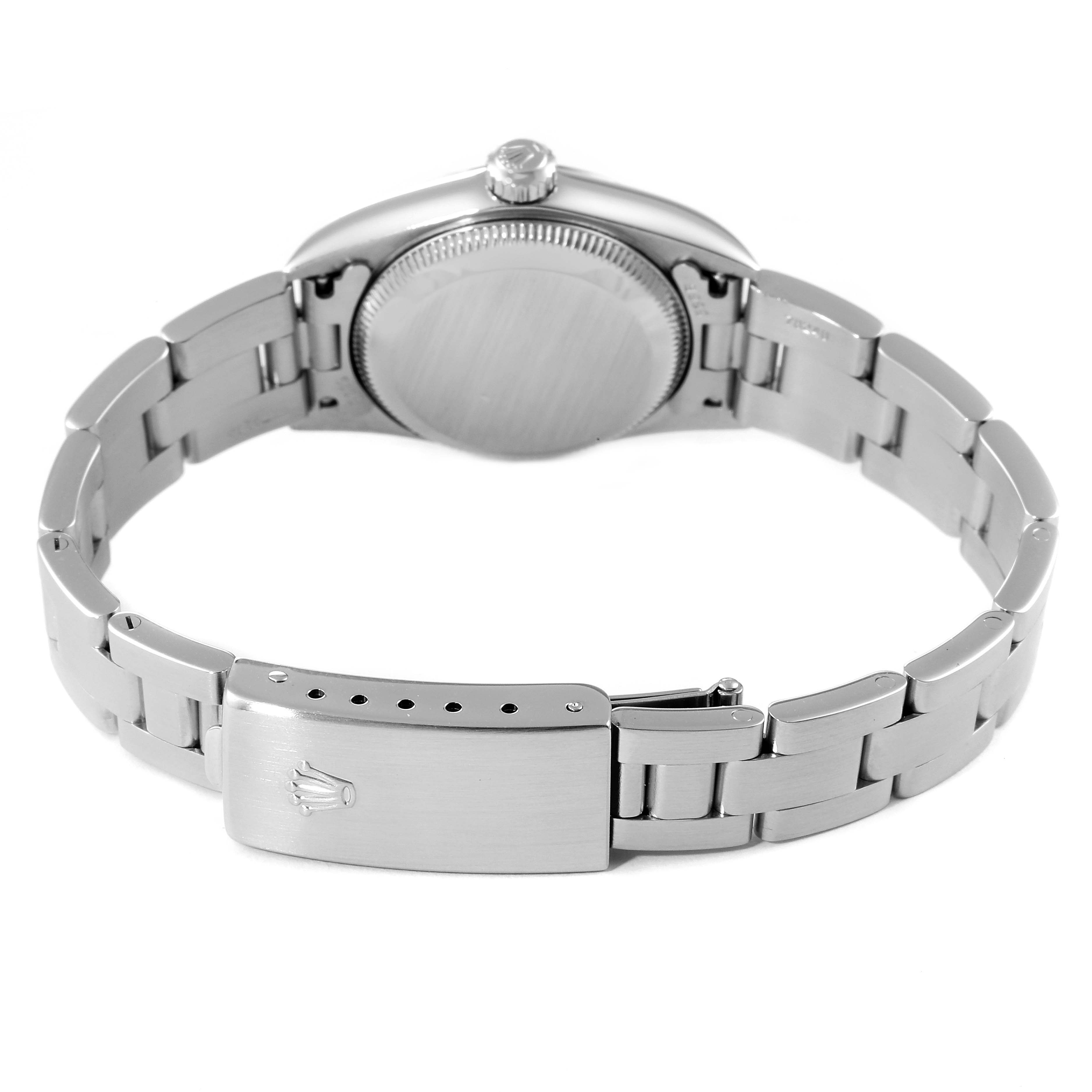 The image shows the backside and bracelet of a Rolex Oyster Perpetual 76080 Women's Stainless Steel Pink Dial 76080 Women's Stainless Steel Pink Dial watch.