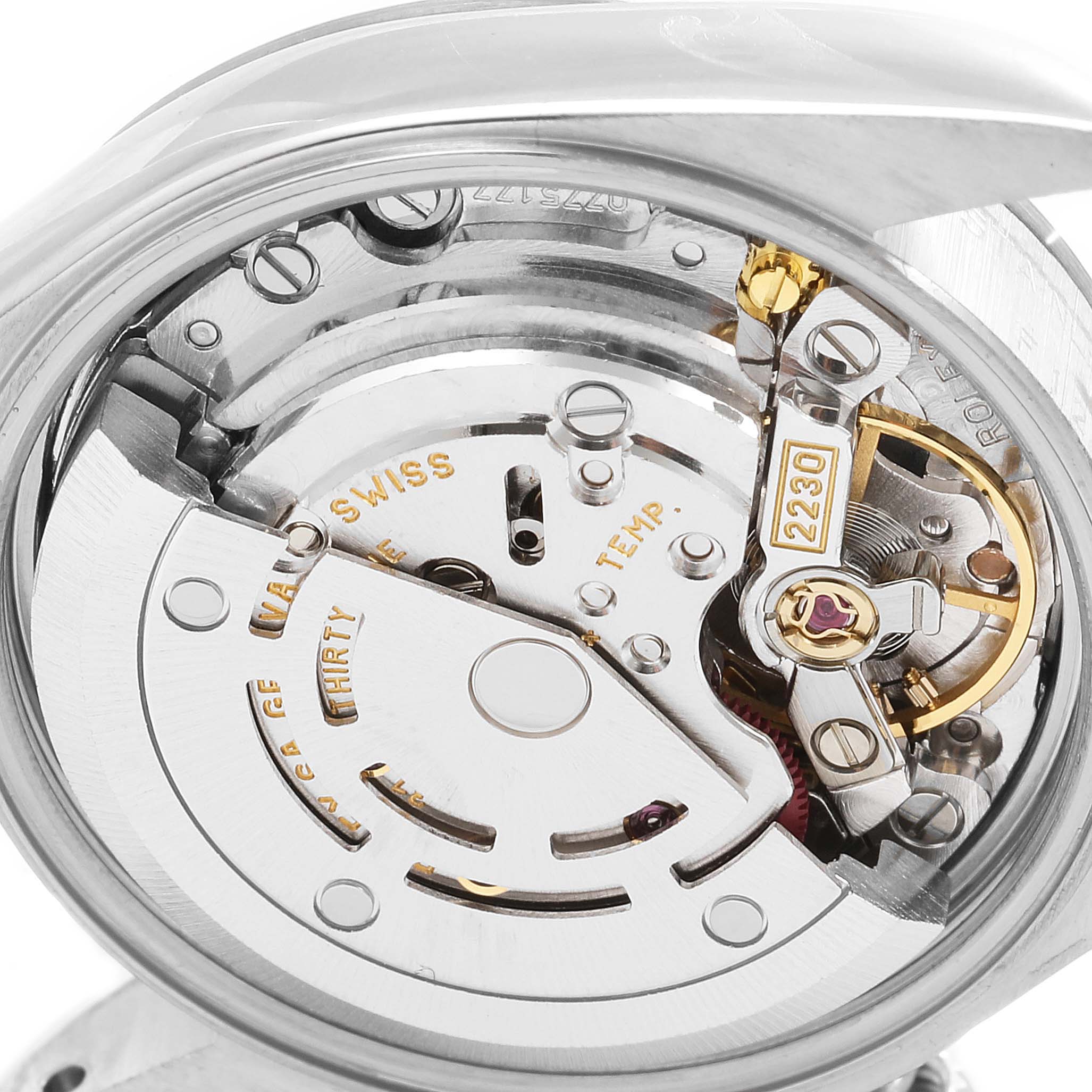 The image shows the intricate internal mechanism of a Rolex Oyster Perpetual 76080 Women's Stainless Steel Pink Dial 76080 Women's Stainless Steel Pink Dial watch from an angled close-up view.