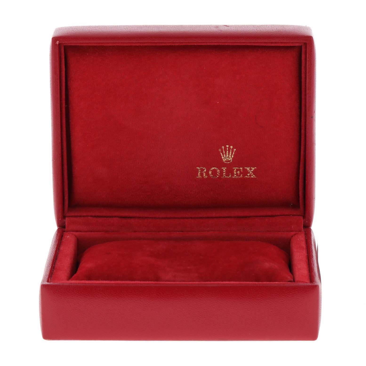 This image shows an empty red Rolex watch box with the lid open, designed for the Oyster Perpetual model.