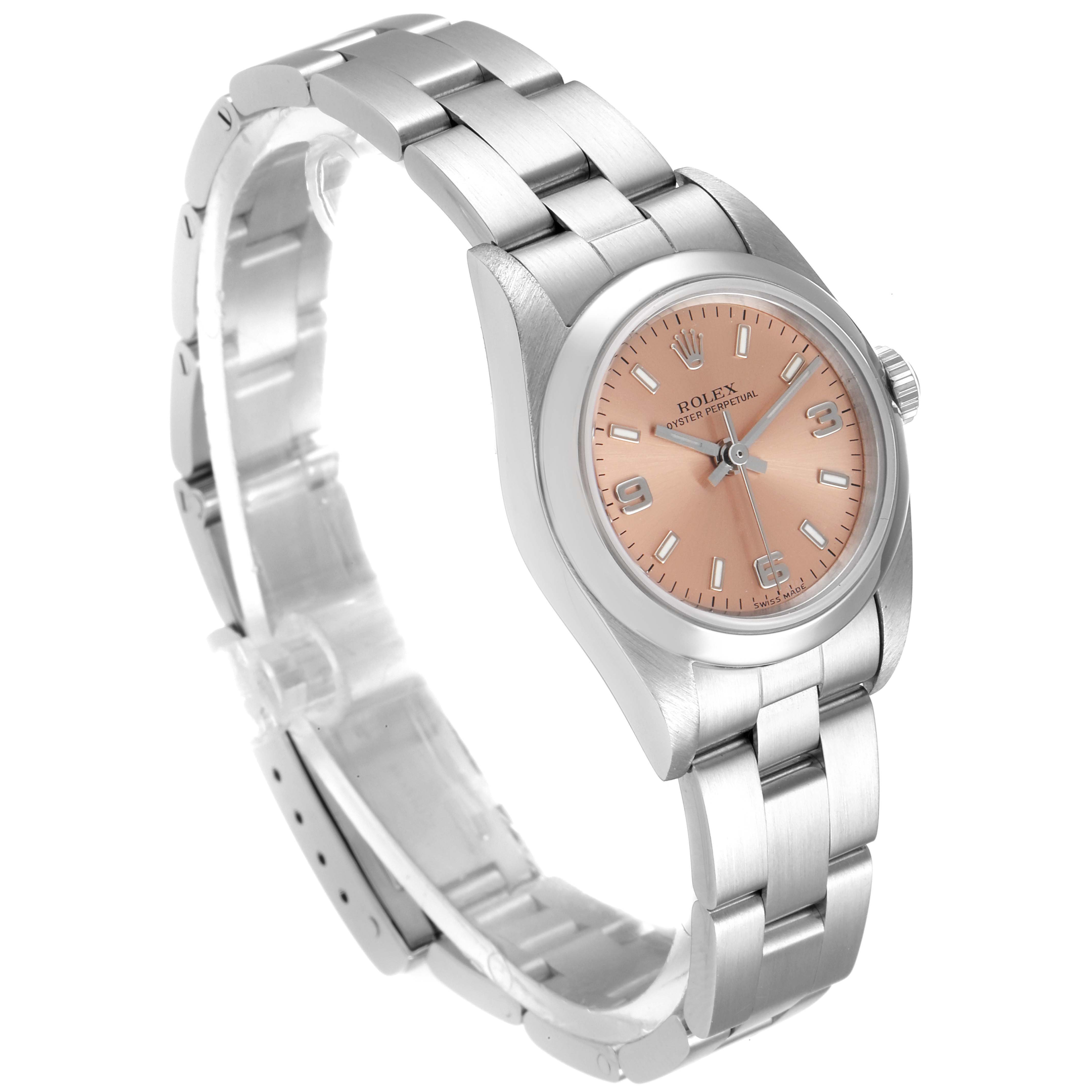 The image depicts a Rolex Oyster Perpetual 76080 Women's Stainless Steel Pink Dial 76080 Women's Stainless Steel Pink Dial watch at a three-quarter angle, showcasing its face, bracelet, and crown.