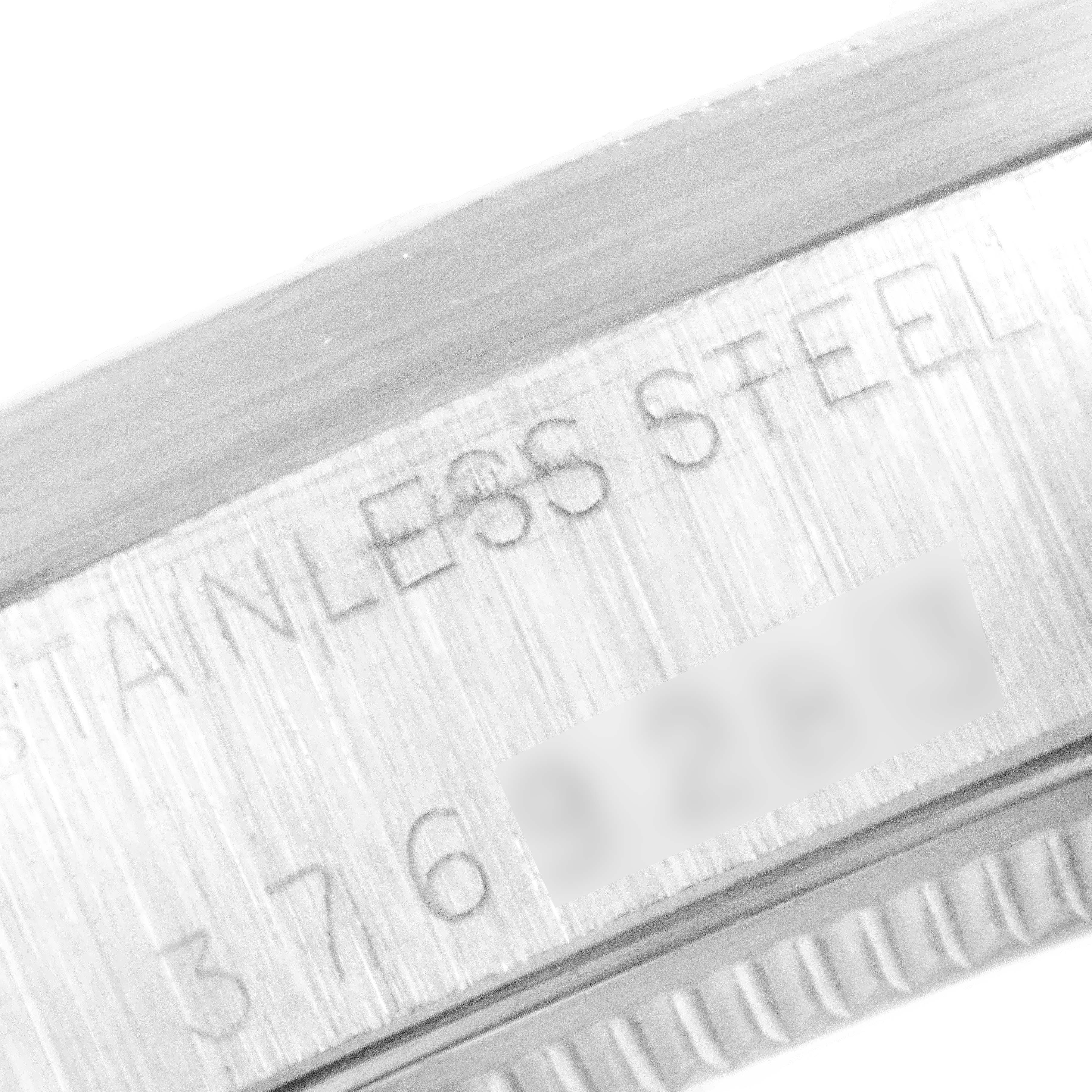 Close-up of the serial number and "Stainless Steel" engraving on a Rolex Vintage Collection 1007 Men's Stainless Steel Silver Dial 1007 Men's Stainless Steel Silver Dial watch.