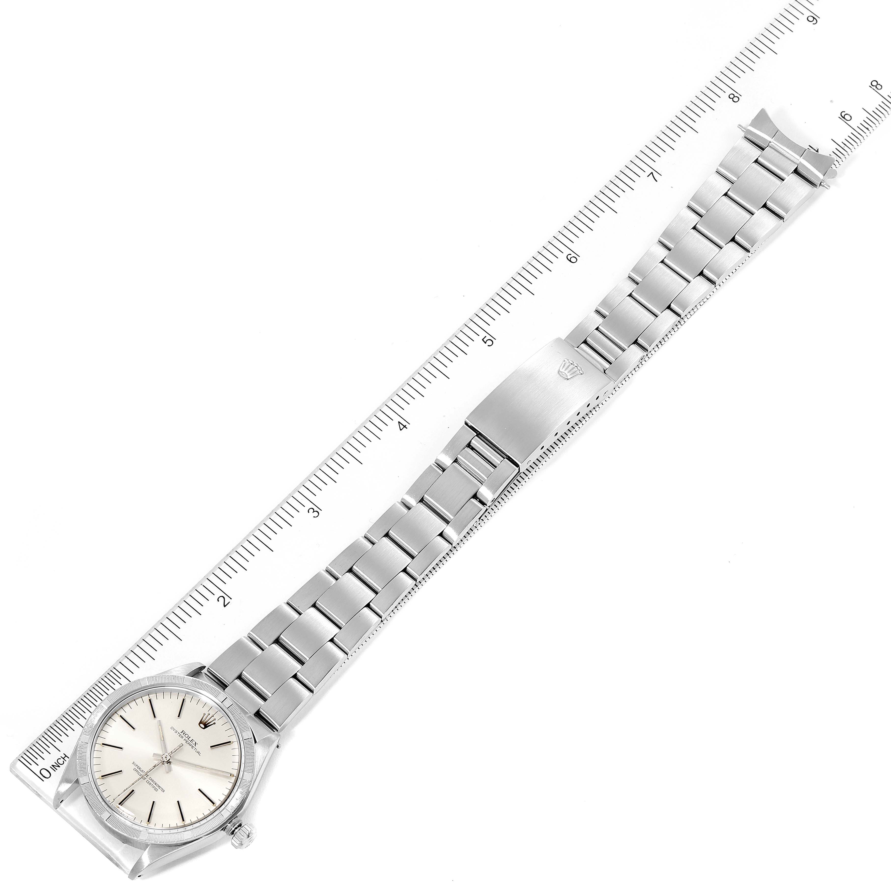 The Rolex Vintage Collection 1007 Men's Stainless Steel Silver Dial 1007 Men's Stainless Steel Silver Dial watch is shown from a top-down angle, displaying the face, clasp, and entire bracelet.