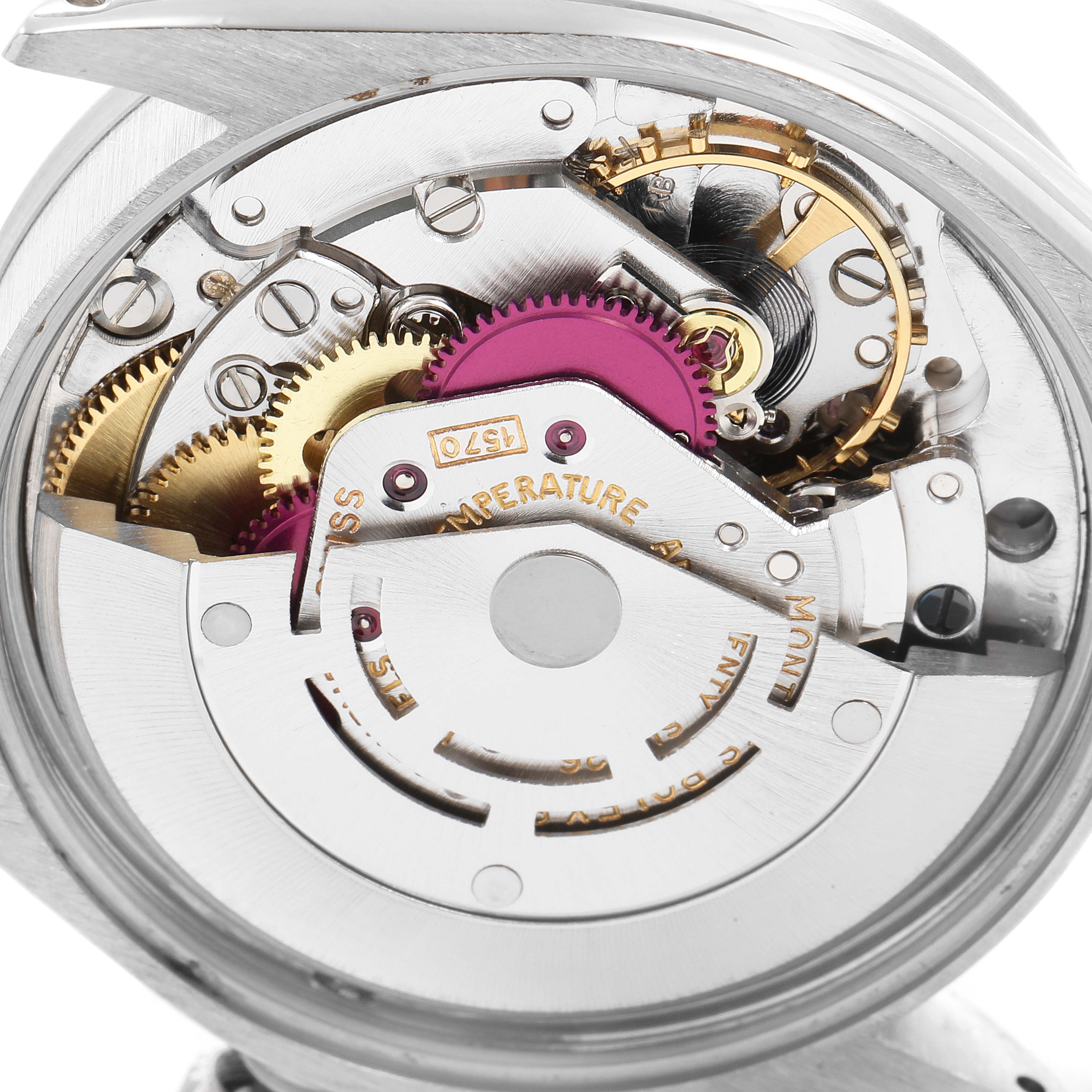 This image shows the internal mechanism of a Rolex Vintage Collection 1007 Men's Stainless Steel Silver Dial 1007 Men's Stainless Steel Silver Dial watch, focusing on the gears and movement.