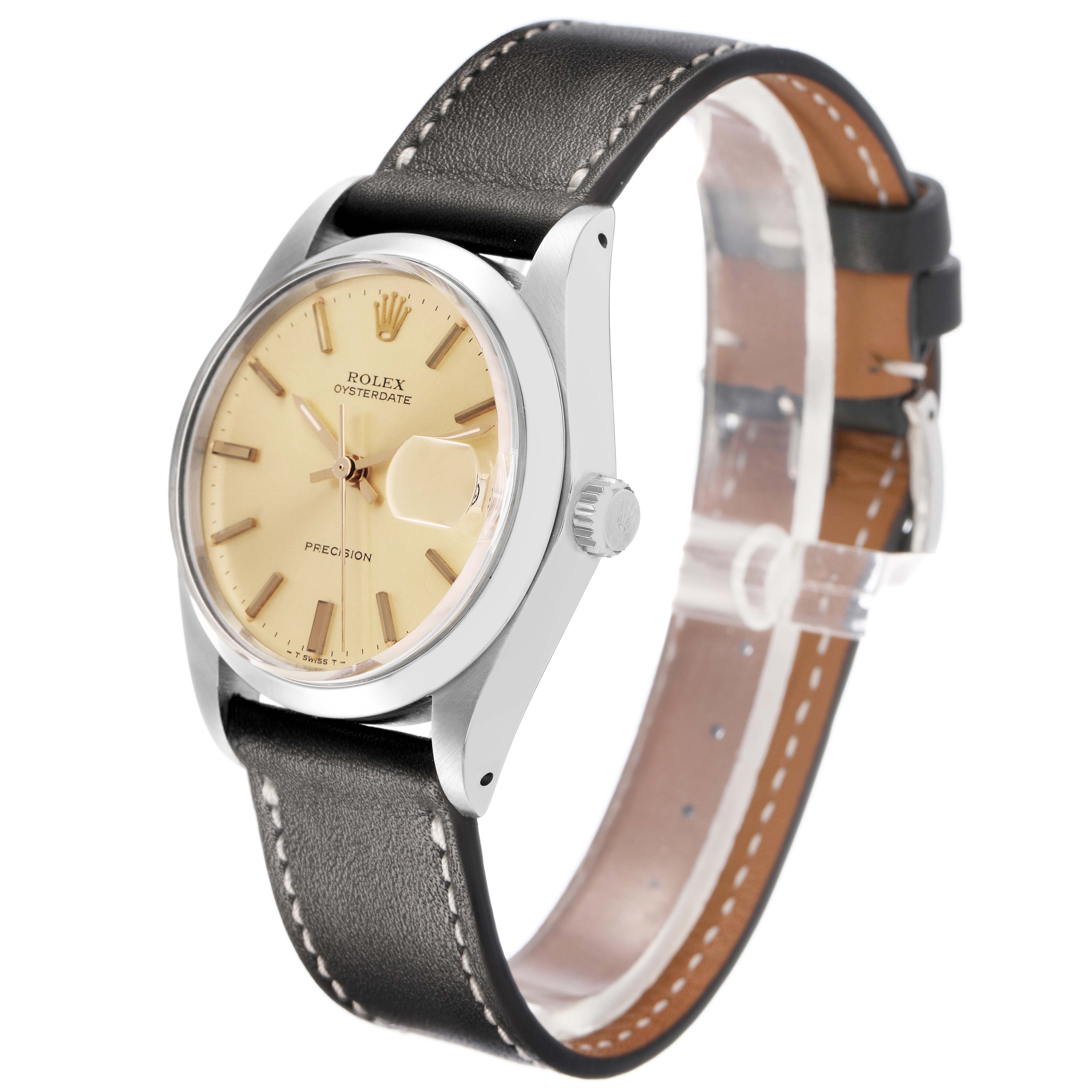 The Rolex Vintage Collection 6694 Men's Stainless Steel Champagne Dial watch is shown at a three-quarter angle, highlighting the beige dial, steel case, and black leather strap.