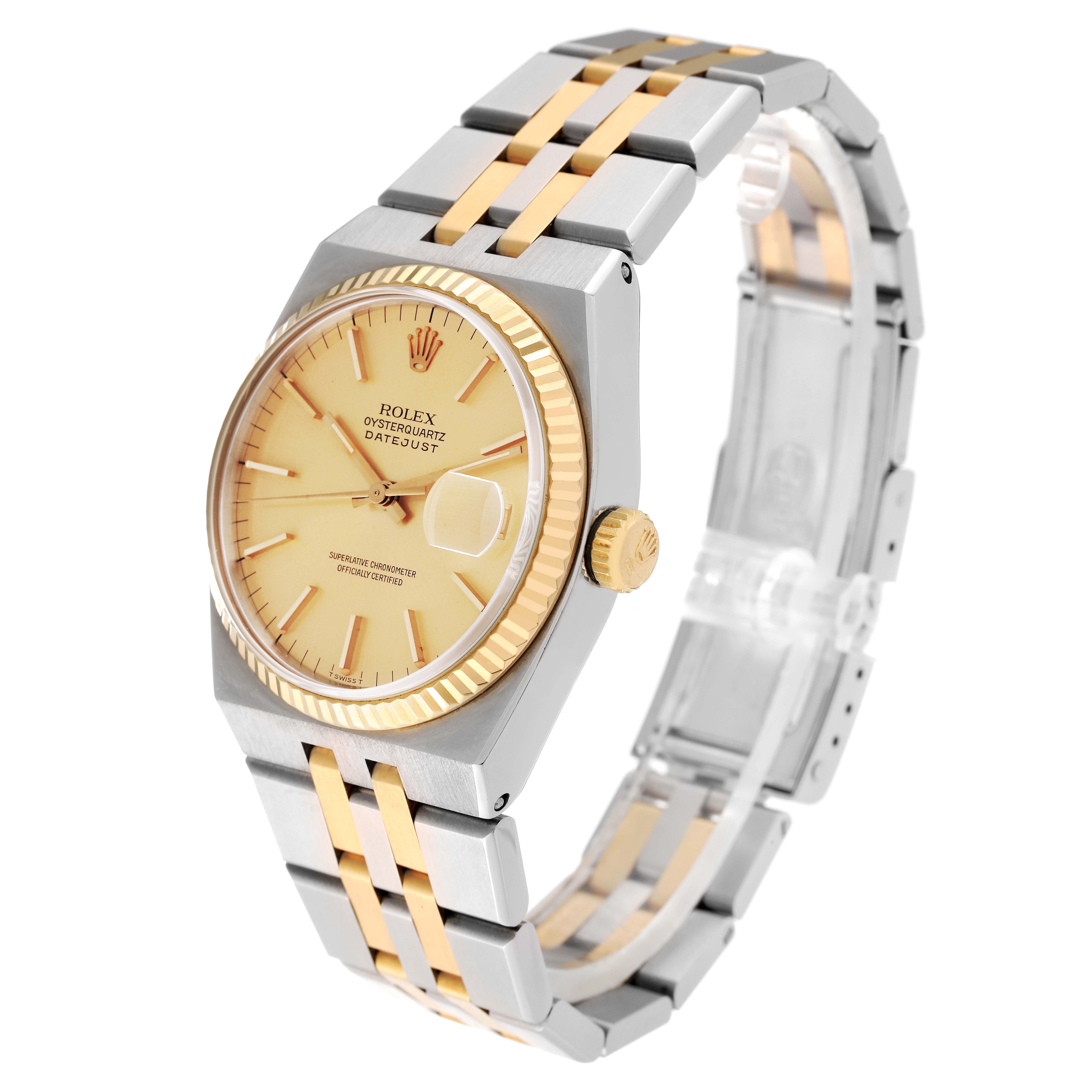The Rolex Oysterquartz 17013 Men's Steel and Gold (two tone) Champagne Dial 17013 Men's Steel and Gold (two tone) Champagne Dial watch is shown at a slight angle, highlighting its yellow-gold dial, fluted bezel, and two-tone bracelet.