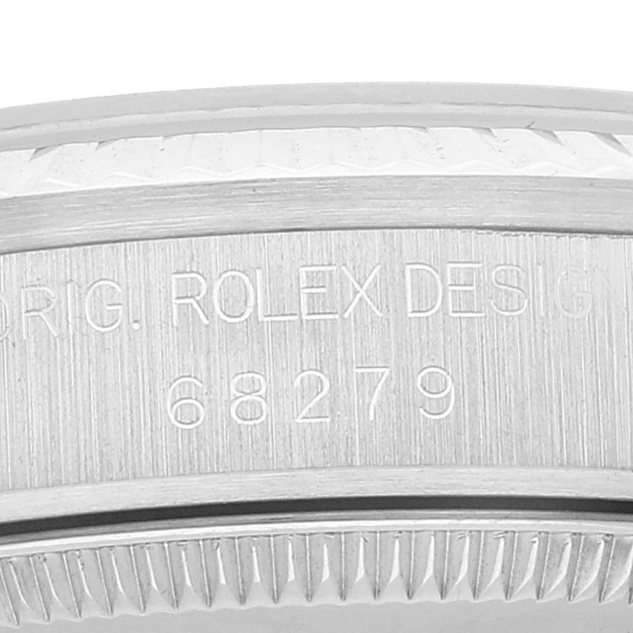 The image shows a close-up of the side bezel and engraved serial number of a Rolex President 68279 Women's White Gold Silver Dial 68279 Women's White Gold Silver Dial model watch.