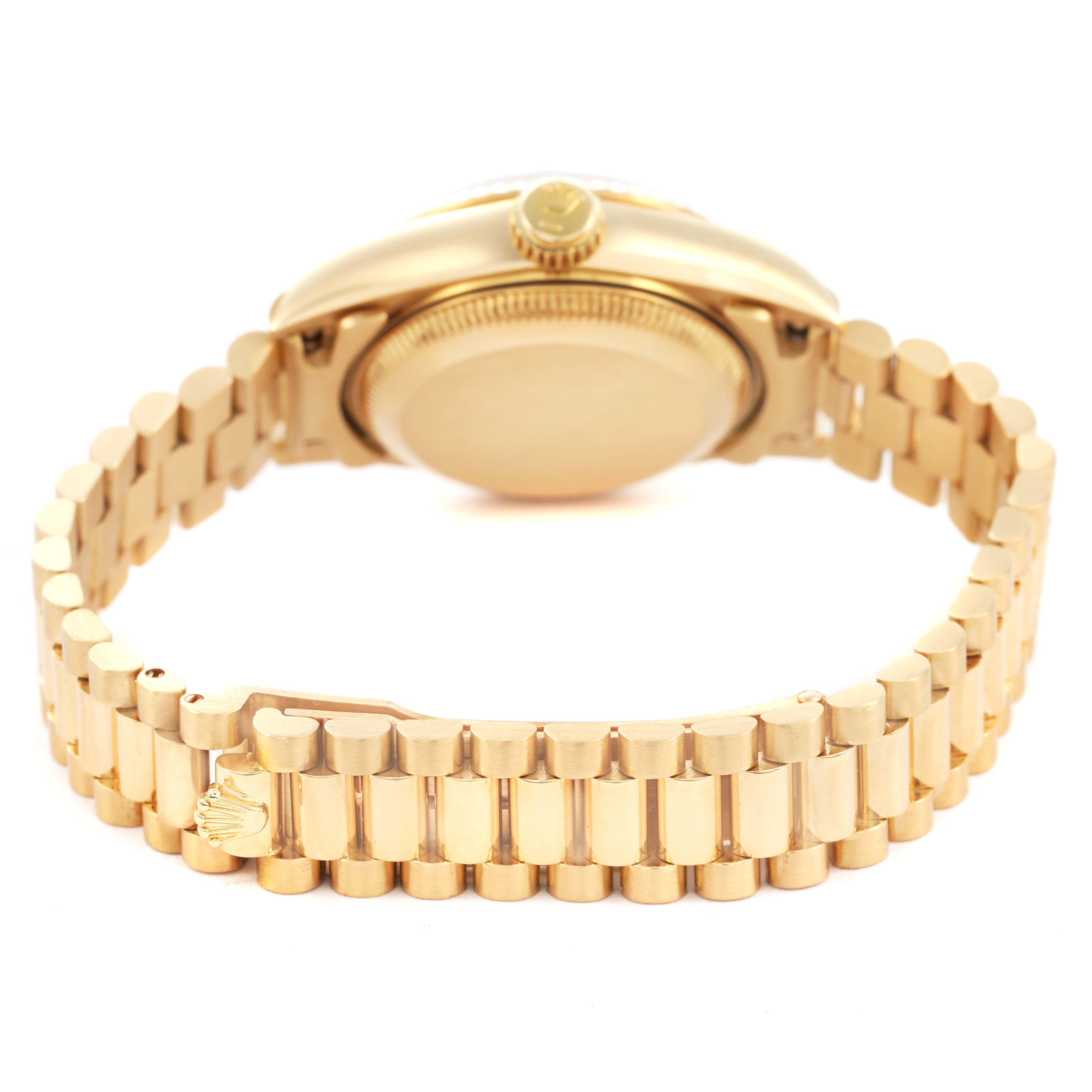 The image shows the backside of a Rolex President 69178 Women's Yellow Gold Champagne Dial watch, highlighting the case back, crown, and bracelet with the clasp visible.