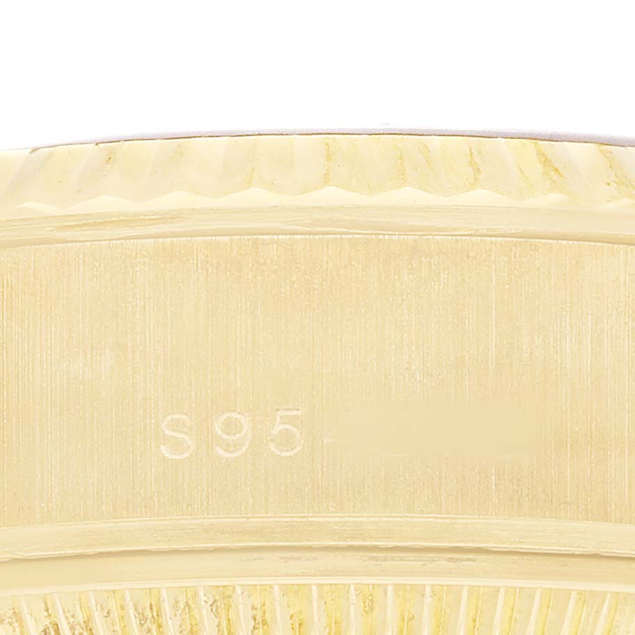The image shows a close-up of the side of a Rolex President 69178 Women's Yellow Gold Champagne Dial watch case, highlighting the edge details and engravings.