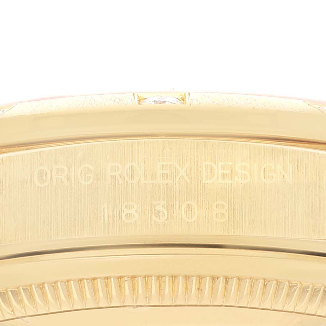 This image shows a close-up view of the case back and part of the bezel of a Rolex President 18308 Men
s Yellow Gold Champagne Dial 18308 Men
s Yellow Gold Champagne Dial model watch.