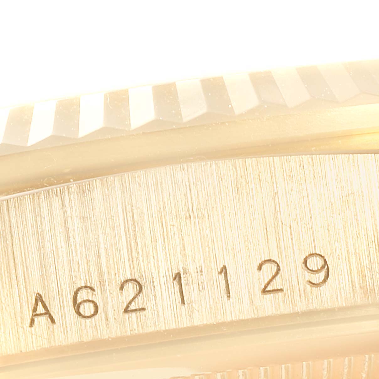 The image shows a close-up of the serial number engraved on the case of a Rolex President 18238 Men
s Yellow Gold White Dial 18238 Men
s Yellow Gold White Dial model watch.