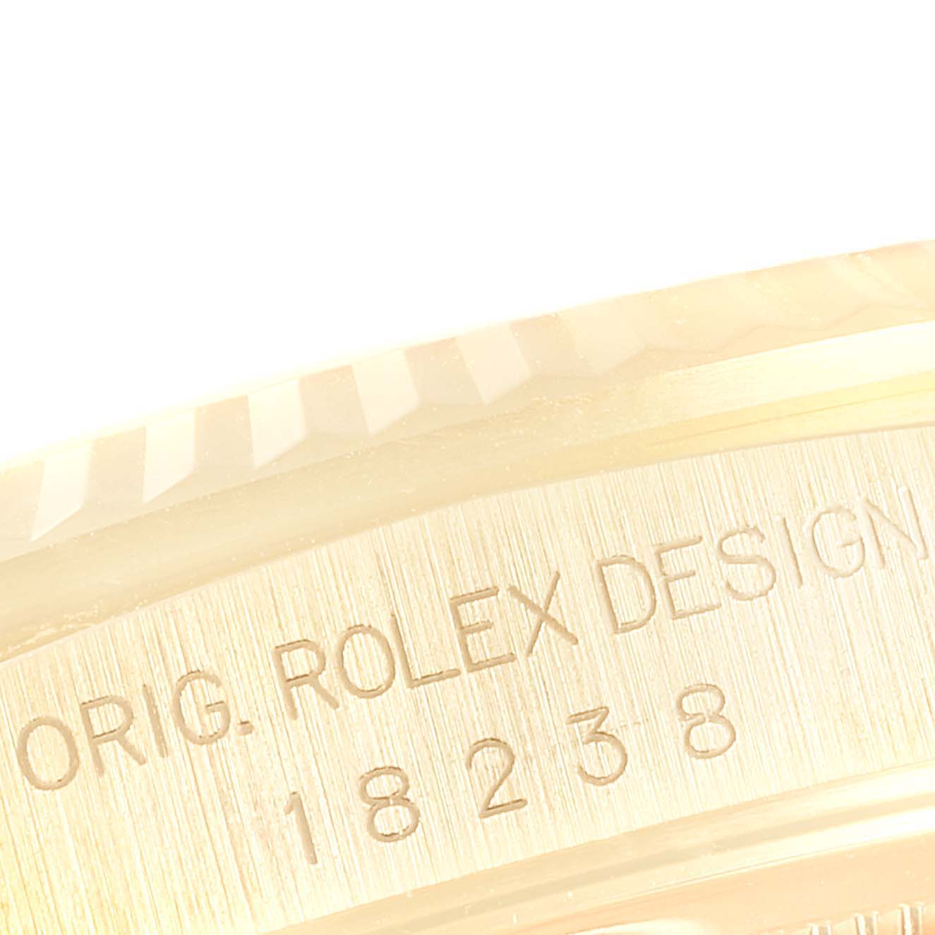 The image shows a close-up of the inner bezel and serial number engraving of a Rolex President 18238 Men
s Yellow Gold White Dial 18238 Men
s Yellow Gold White Dial model watch.
