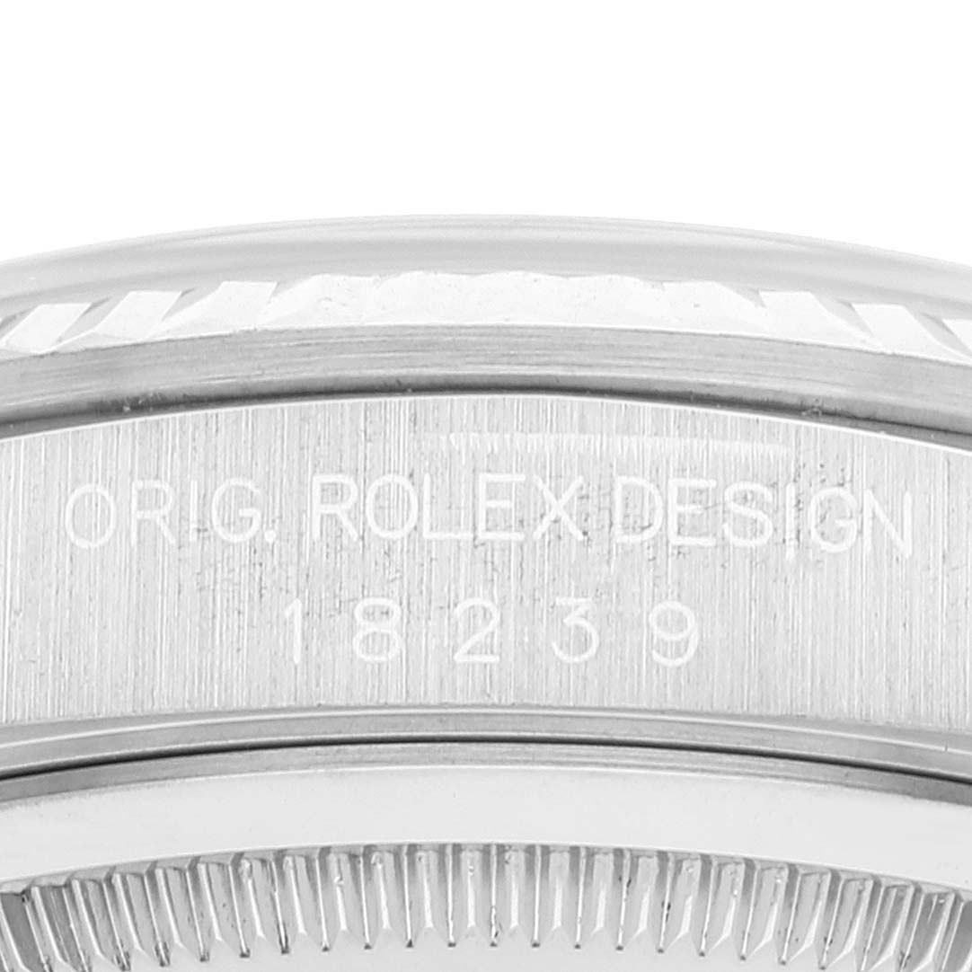 This image shows a close-up of the side of a Rolex President 18239 Men's White Gold Silver Dial 18239 Men's White Gold Silver Dial model watch displaying "ORIG. ROLEX DESIGN 18239."