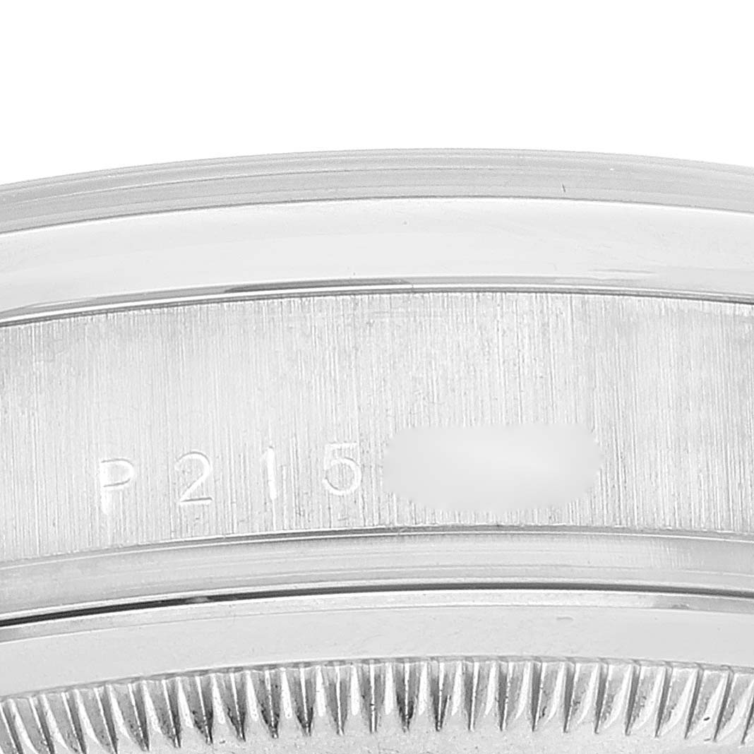 This image shows a close-up of the case back and serial number area on a Rolex President 118209 Men's White Gold Silver Dial 118209 Men's White Gold Silver Dial model watch.