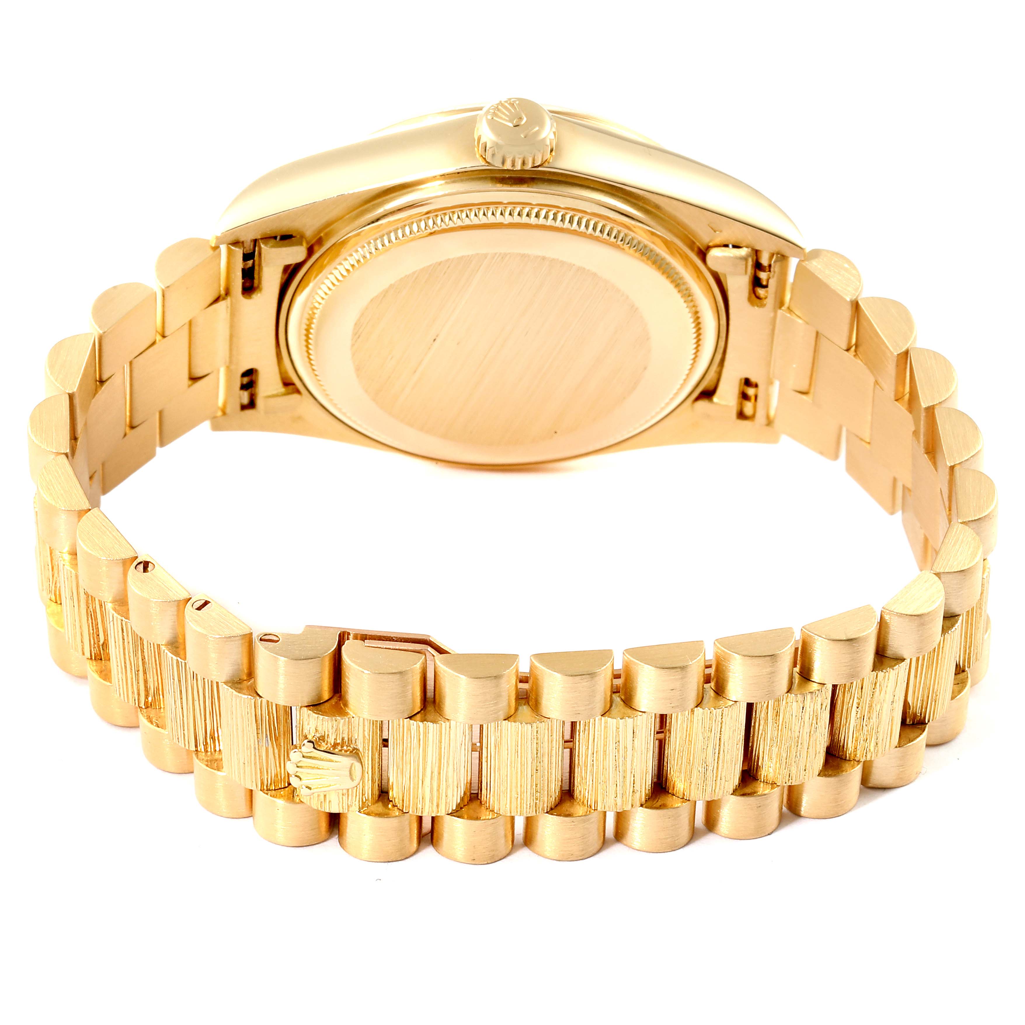 This image shows the backside of a Rolex President 18078 Men
s Yellow Gold Champagne Dial 18078 Men
s Yellow Gold Champagne Dial model watch, focusing on the case back and the gold bracelet.